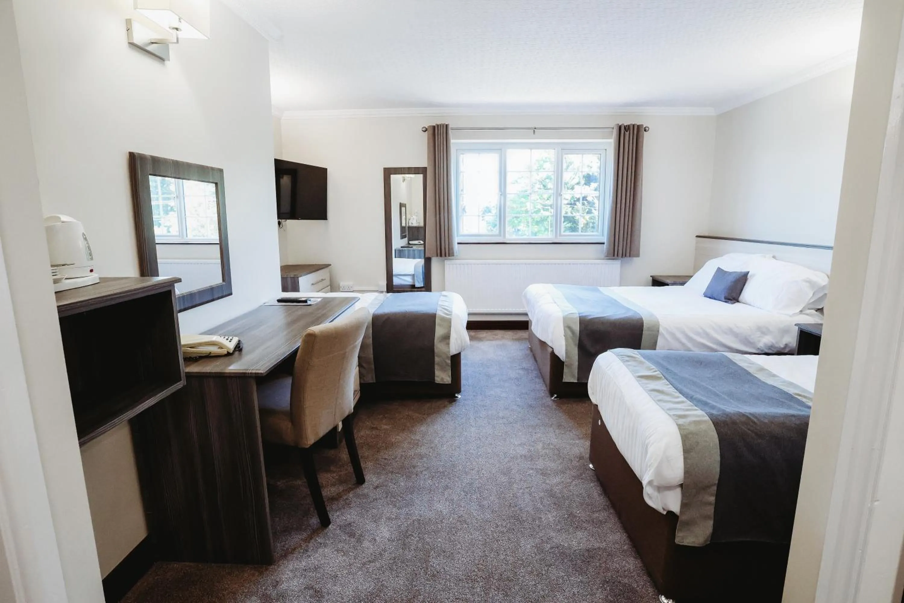 Bed in The Appleby Inn Hotel