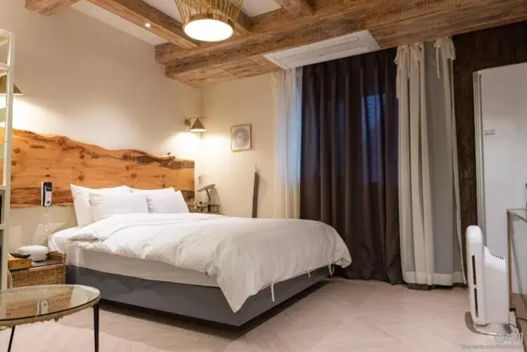 Bed in SongJeong Lesign Hotel Bed in SongJeong Lesign Hotel