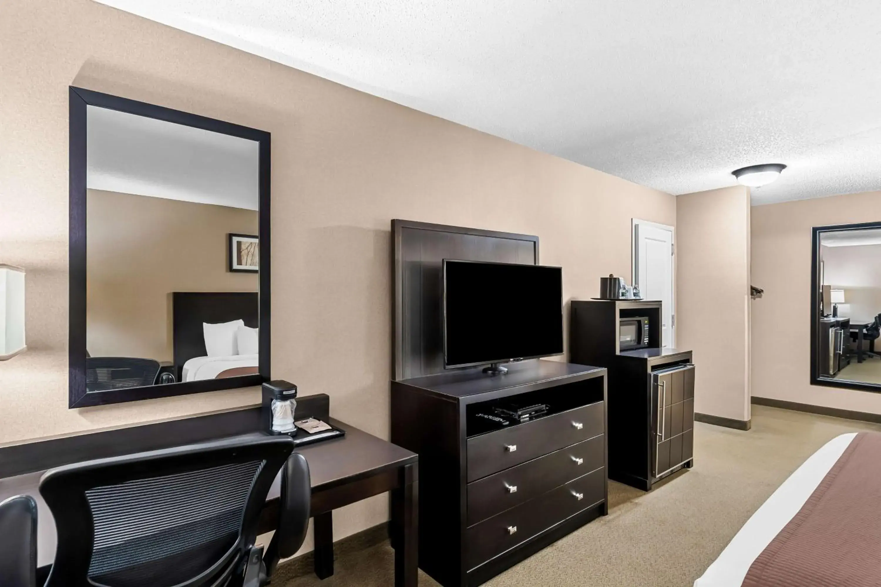 Bedroom in Heartland Inn & Suites, SureStay Collection by Best Western Bedroom in Heartland Inn & Suites, SureStay Collection by Best Western