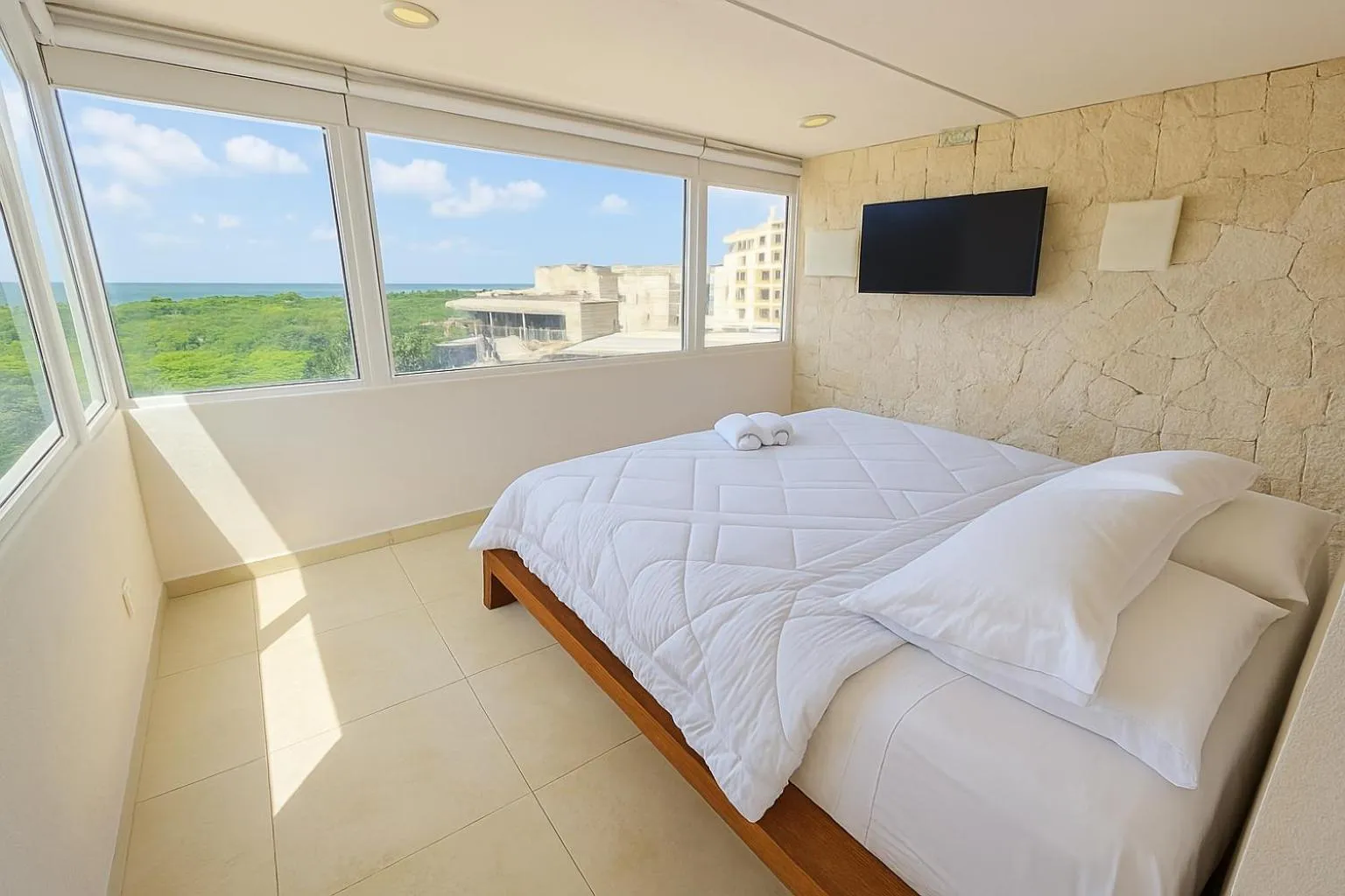 Bed in Beach Front Condos in Hotel Zone