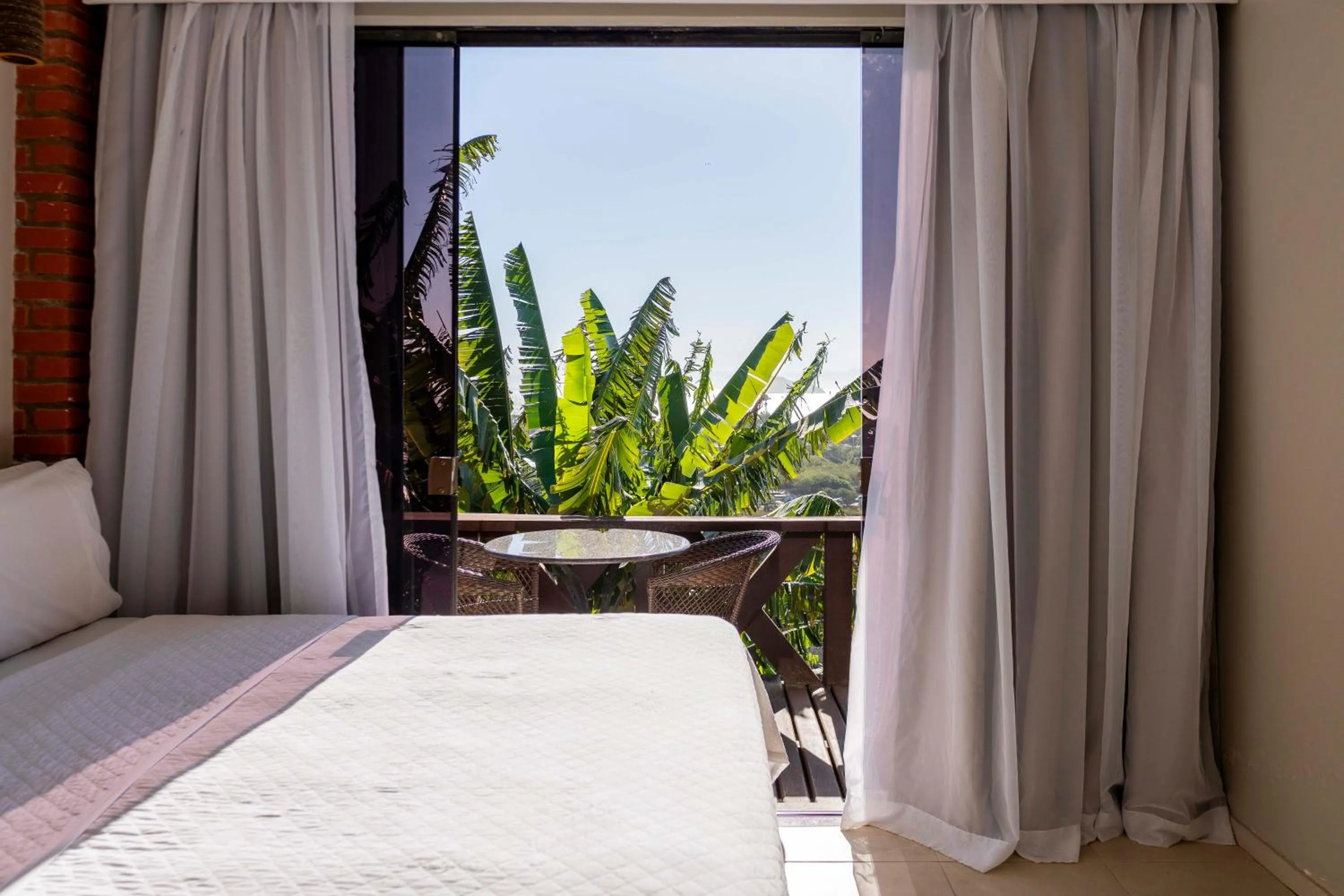 View (from property/room), Bed in Costa do Sol Boutique Hotel