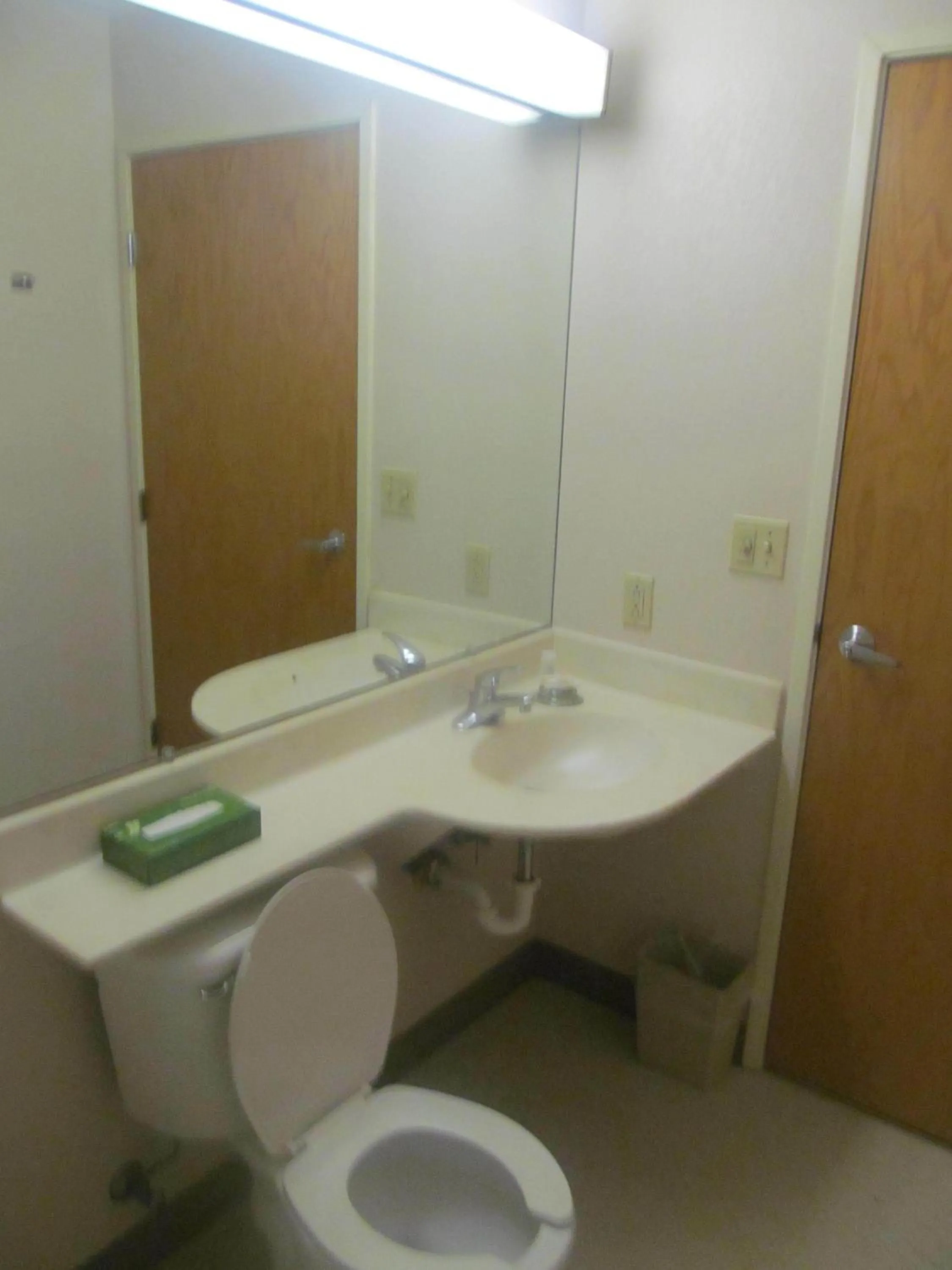 Toilet in Microtel Inn by Wyndham Champaign