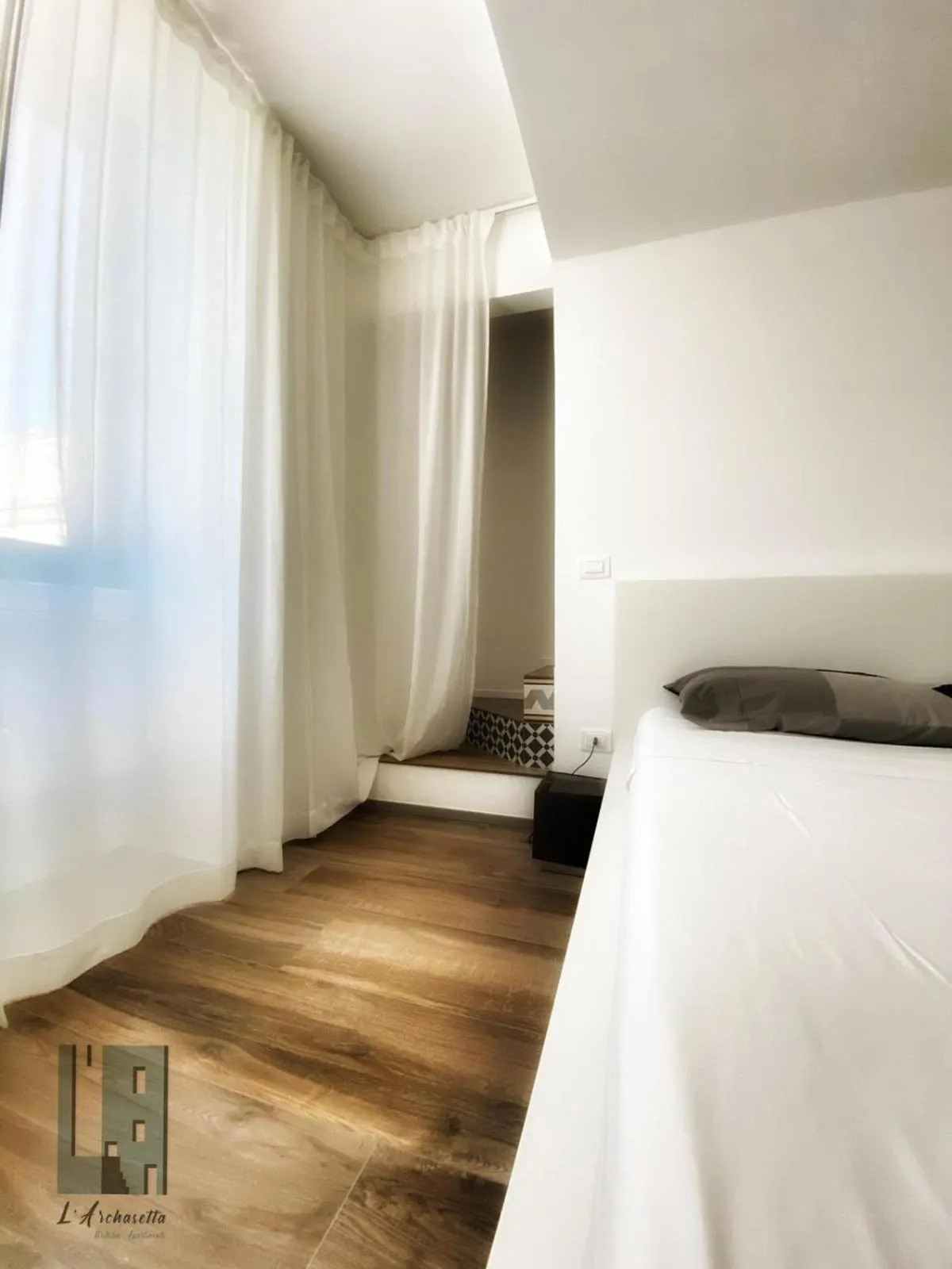 Photo of the whole room in L'ArChasetta Historic Apartments