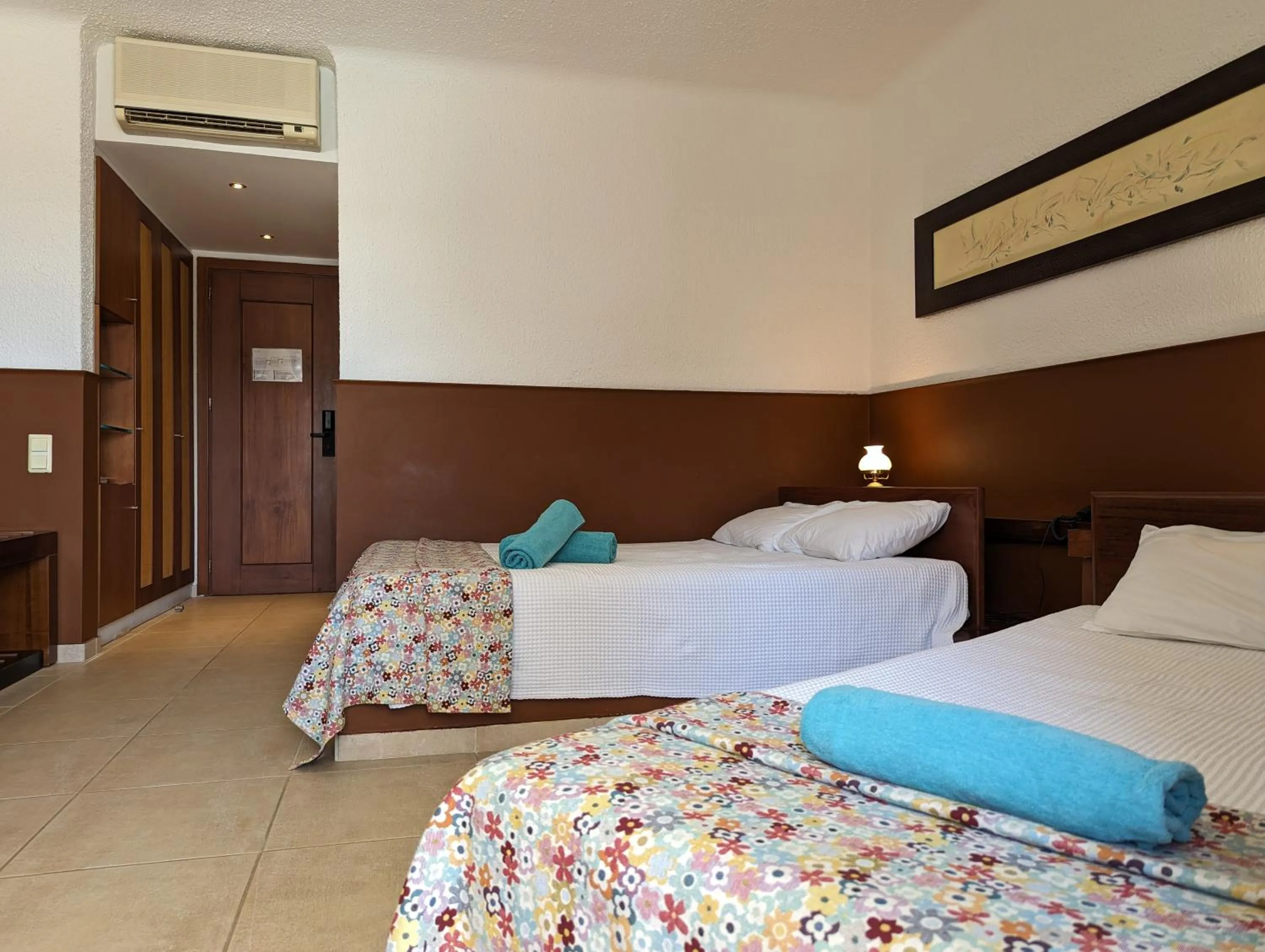 Bed in Apollonia Beach Resort & Spa