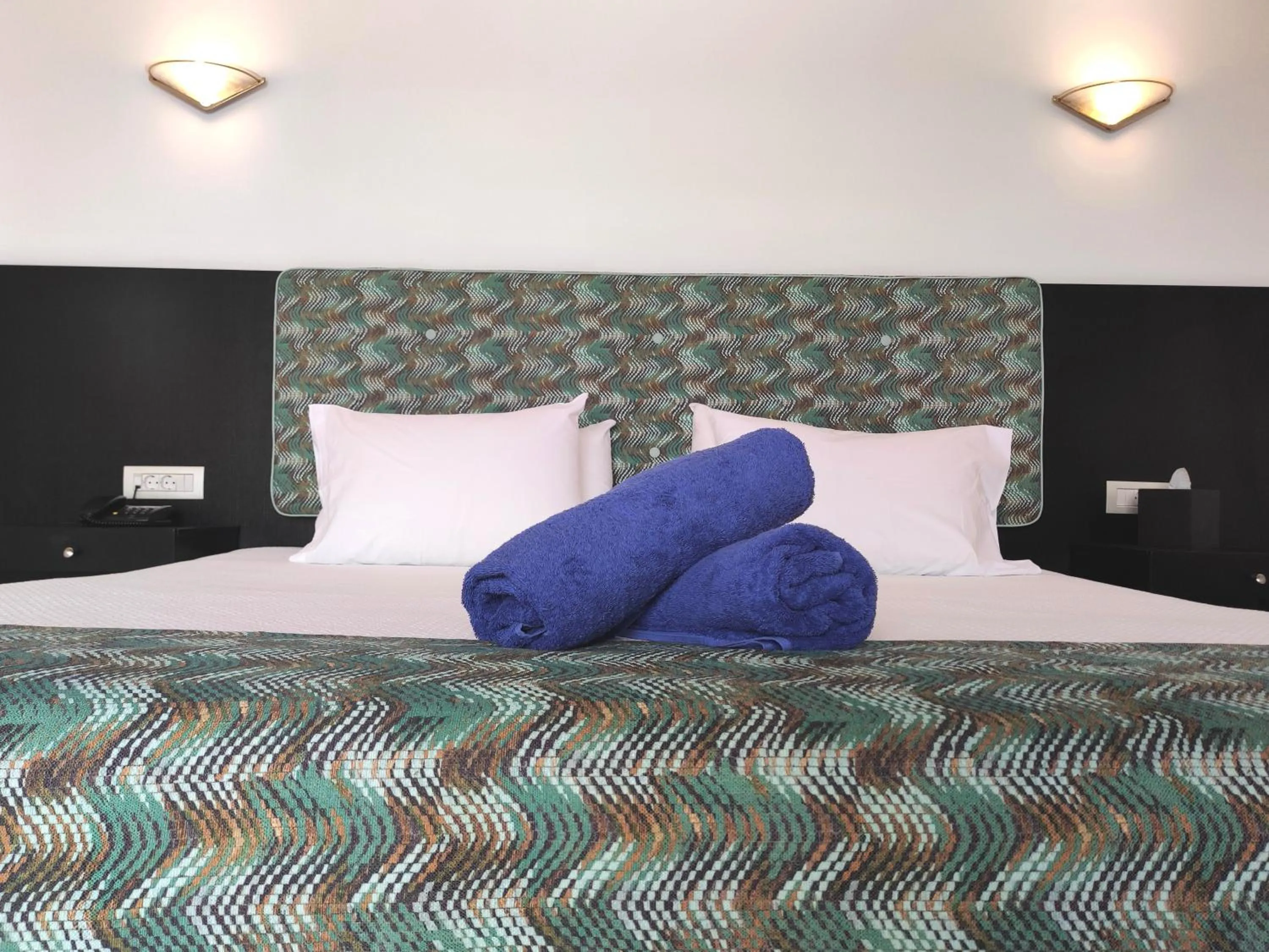 Bed in Apollonia Beach Resort & Spa