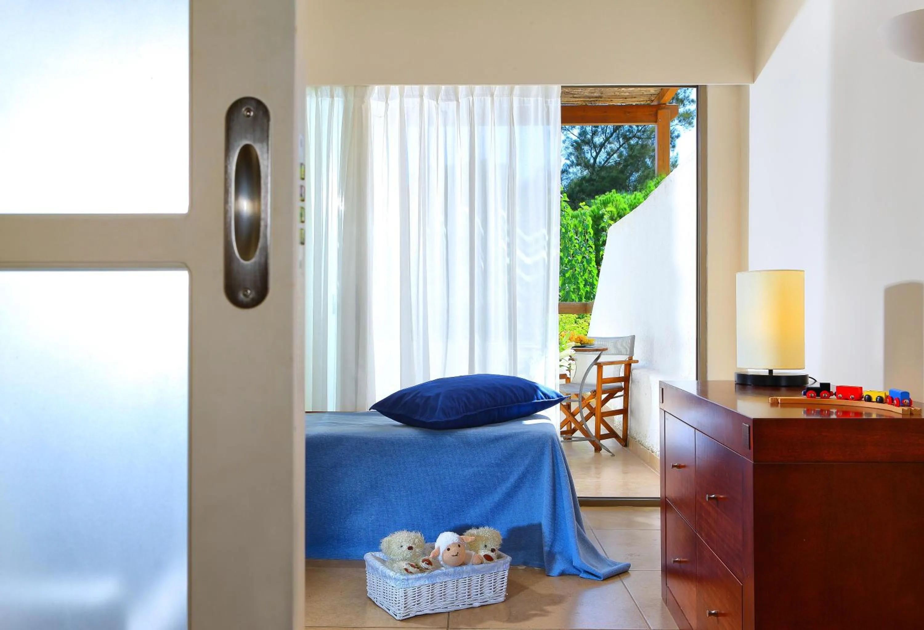 Bed in Apollonia Beach Resort & Spa