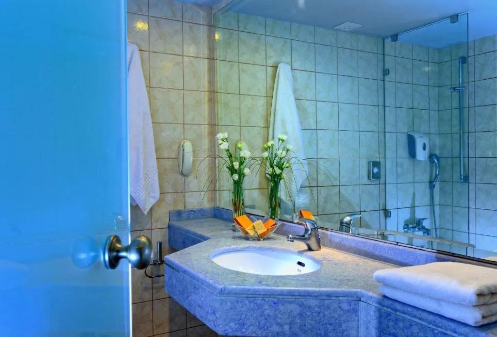 Bathroom in Apollonia Beach Resort & Spa