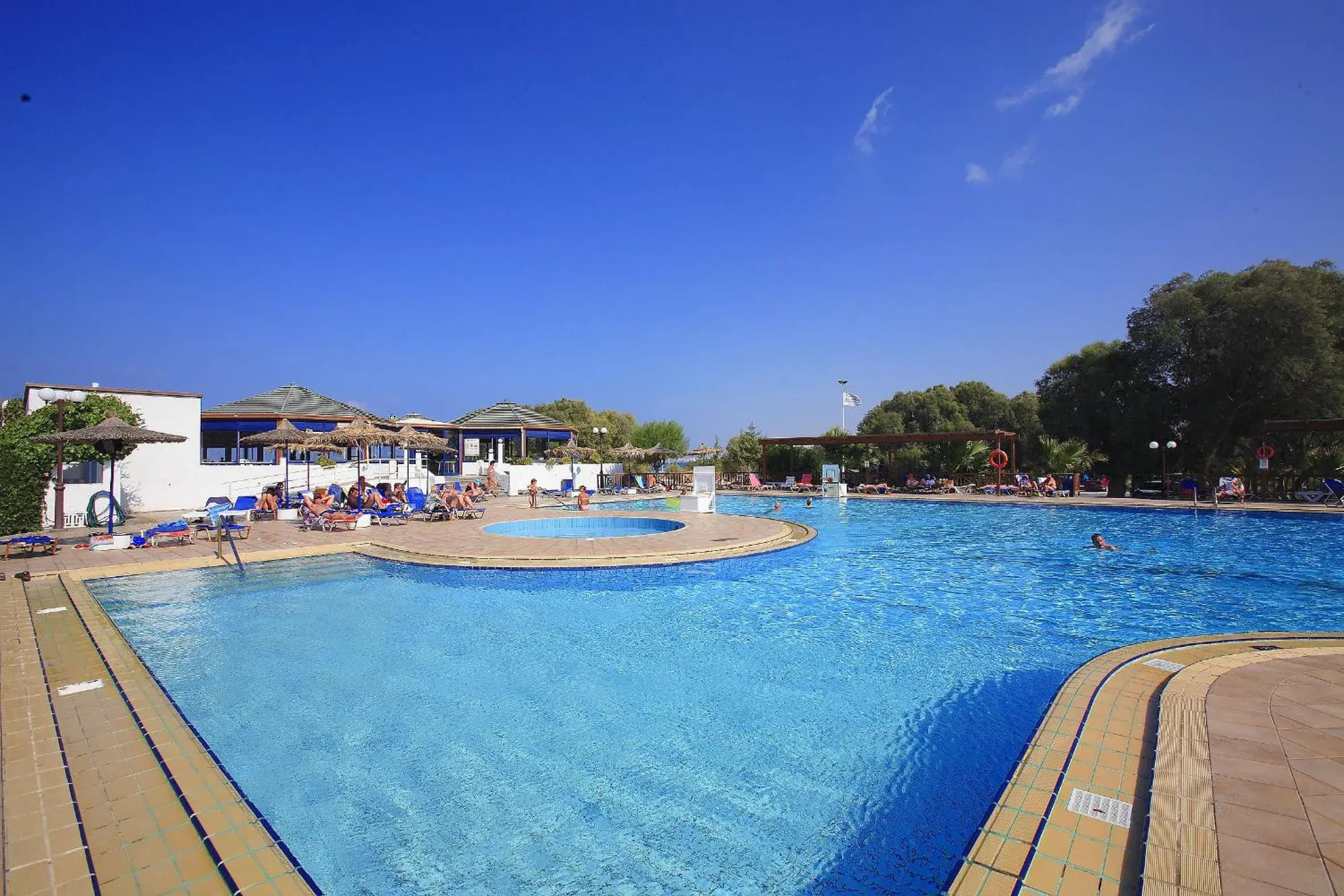 Swimming pool in Apollonia Beach Resort & Spa Swimming pool in Apollonia Beach Resort & Spa