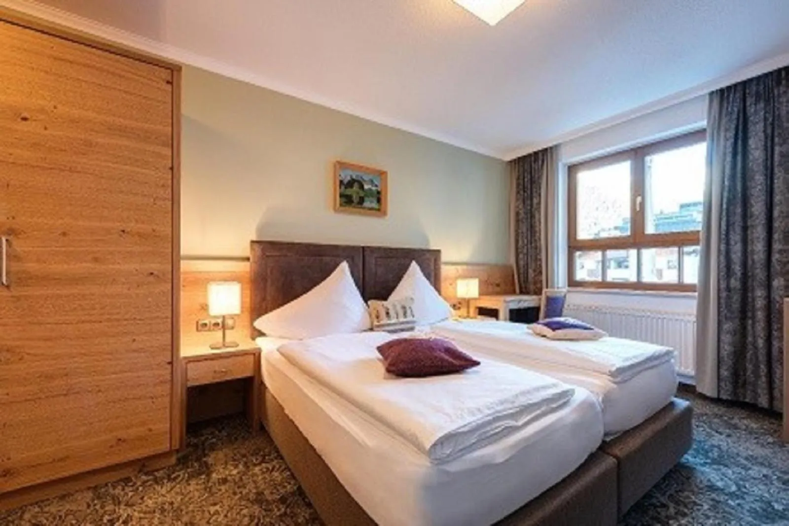 Bed in Aparthotel Acksteiner