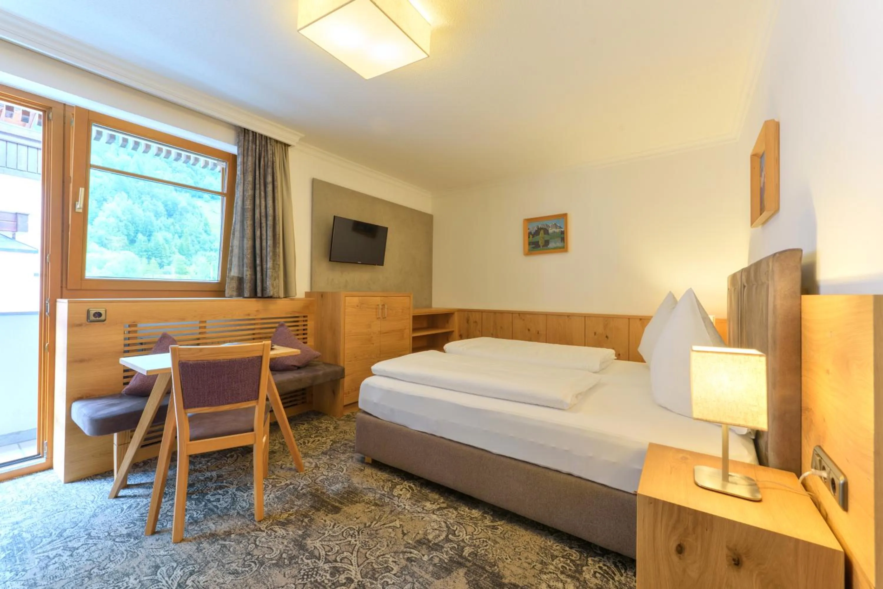 Bed in Aparthotel Acksteiner