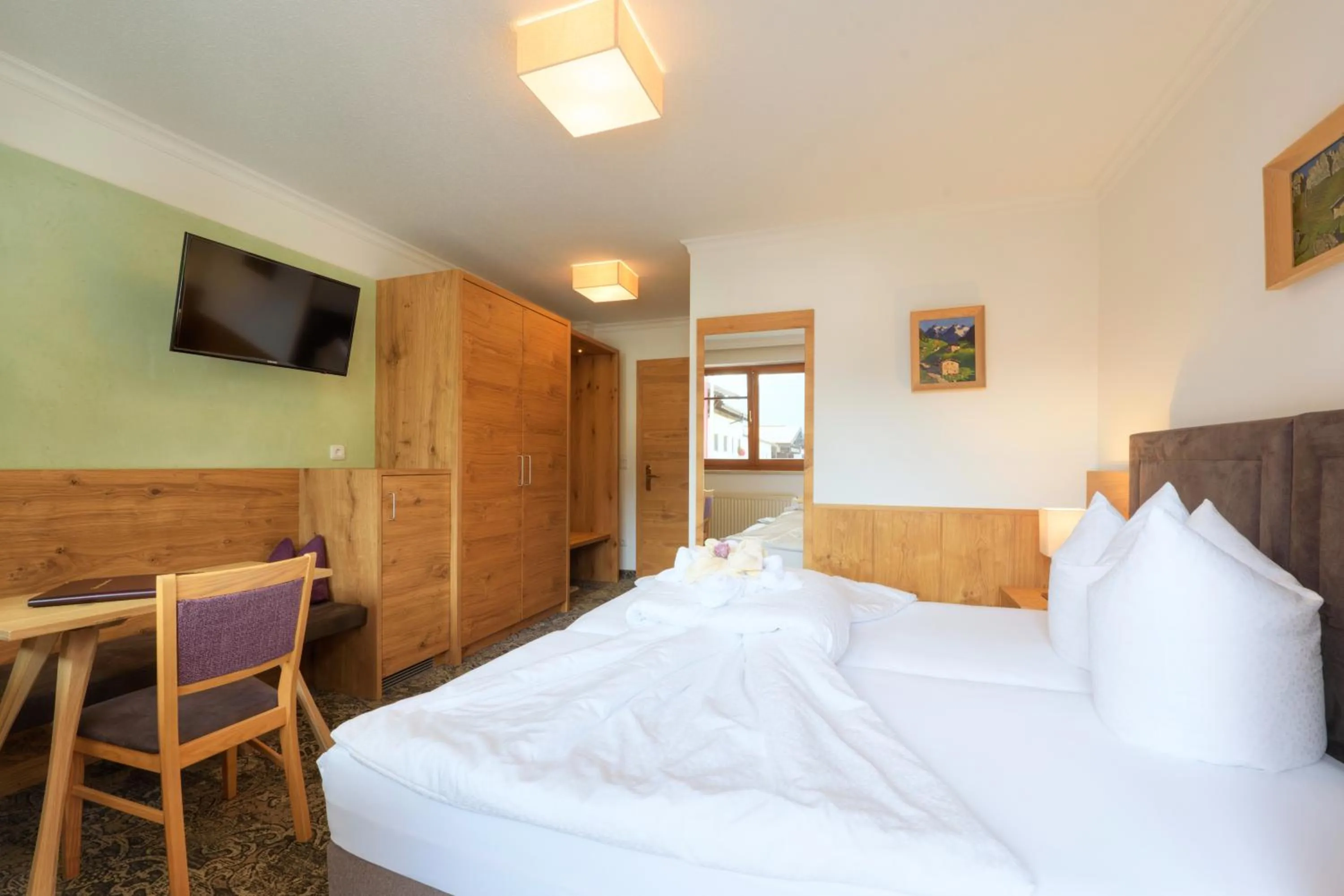 Bed in Aparthotel Acksteiner