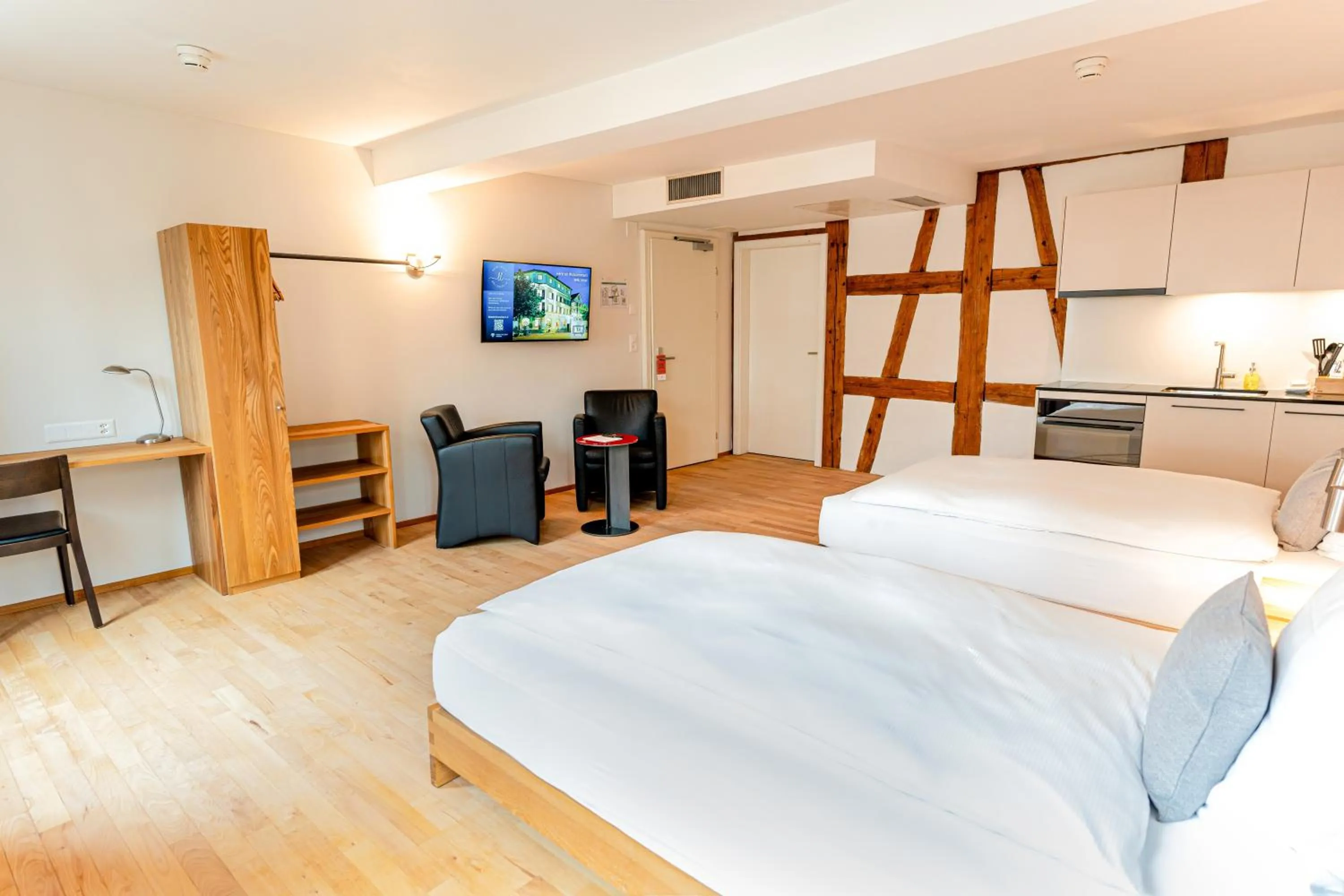 Bed in Hotel Le Lion - Self Check-in