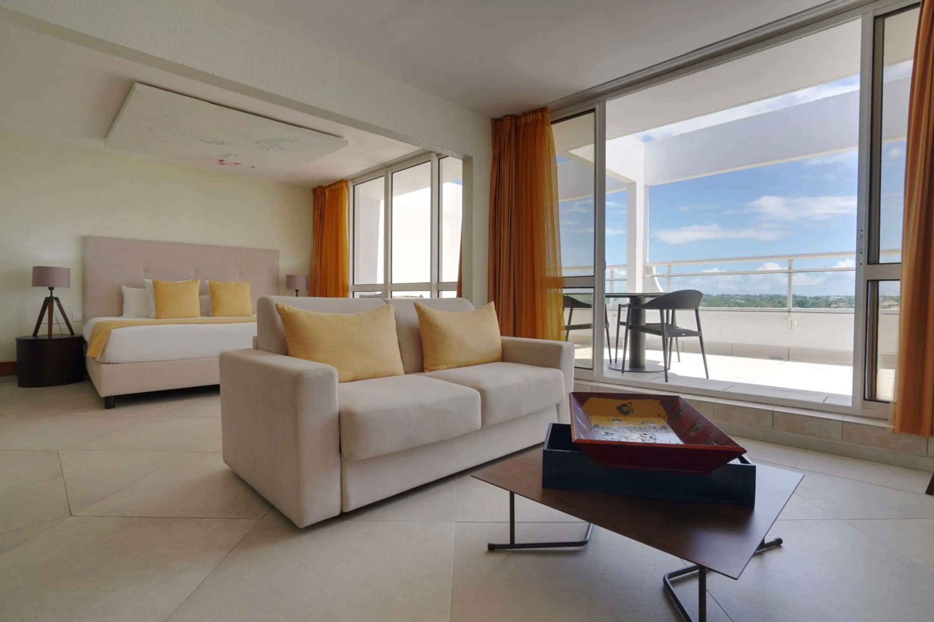 Bed in Hotel Arawak Beach Resort