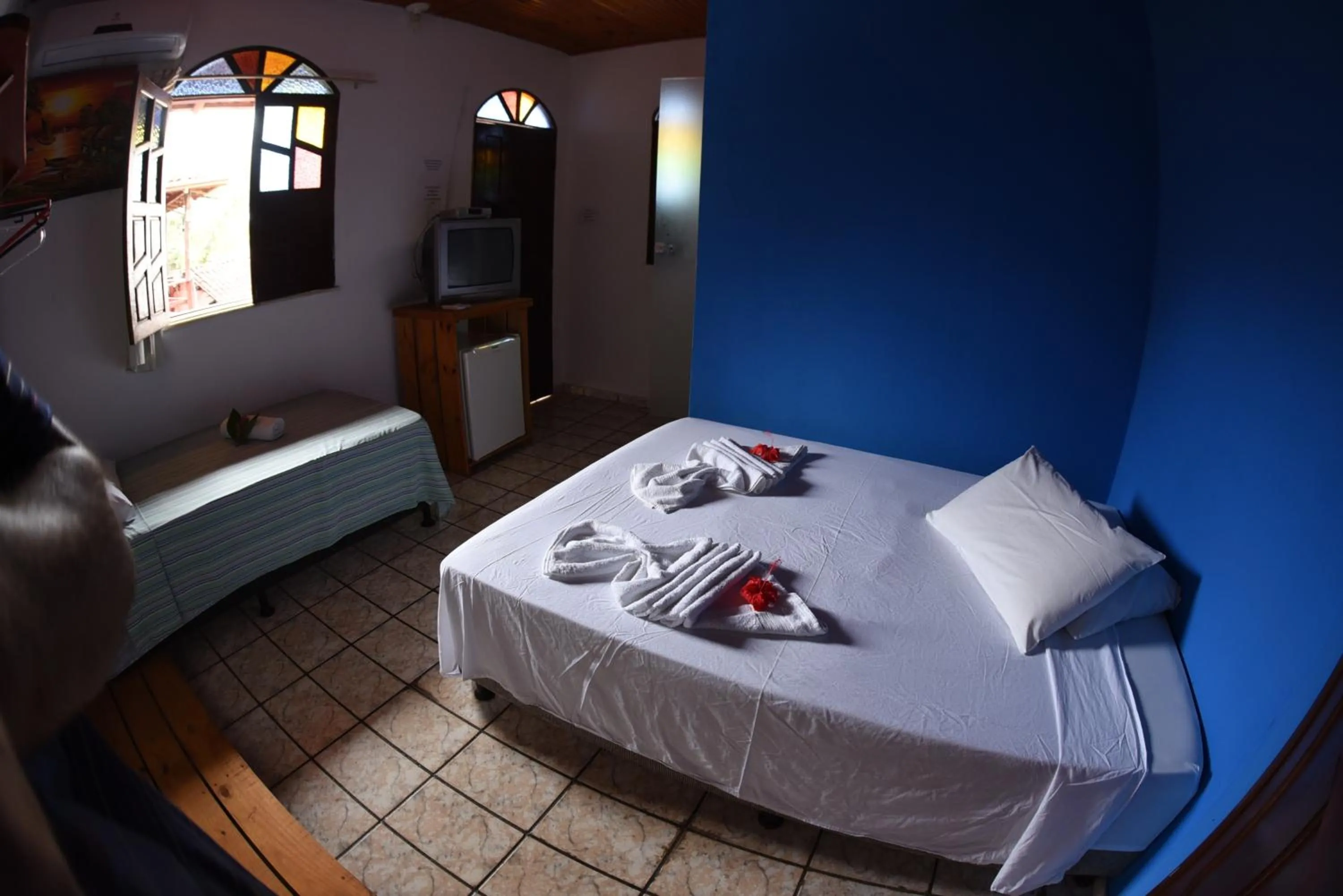 Bed in Pico das Praias Suites