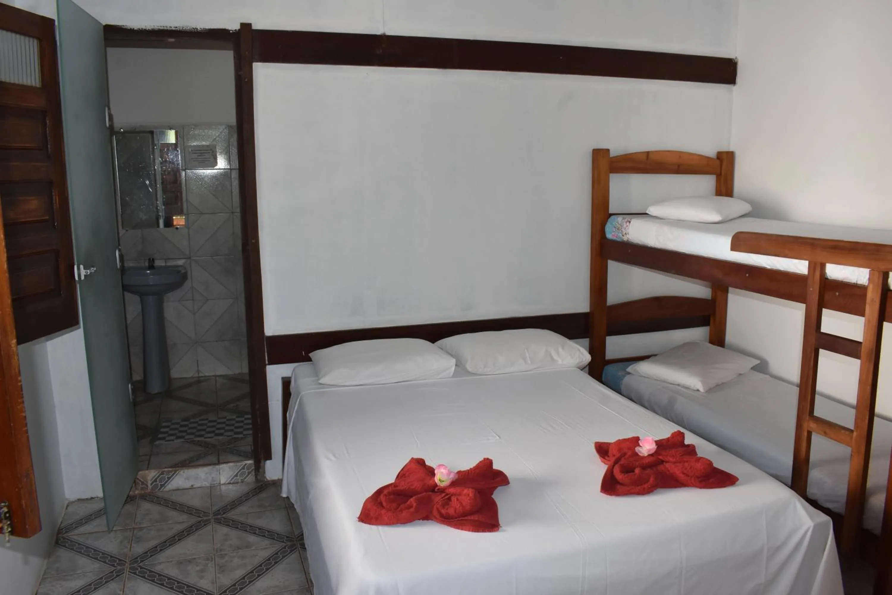 Bed in Pico das Praias Suites