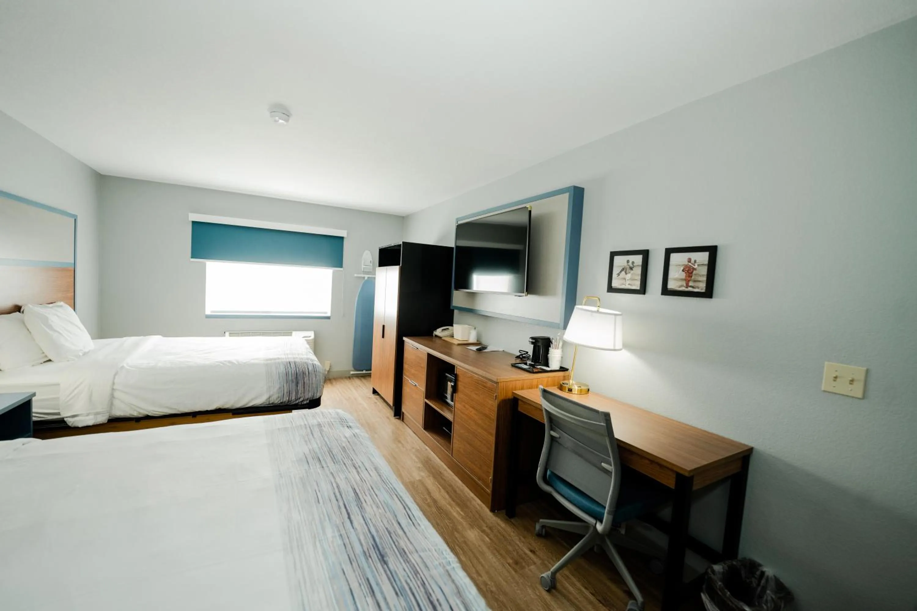 Bed in AmericInn by Wyndham Tomahawk