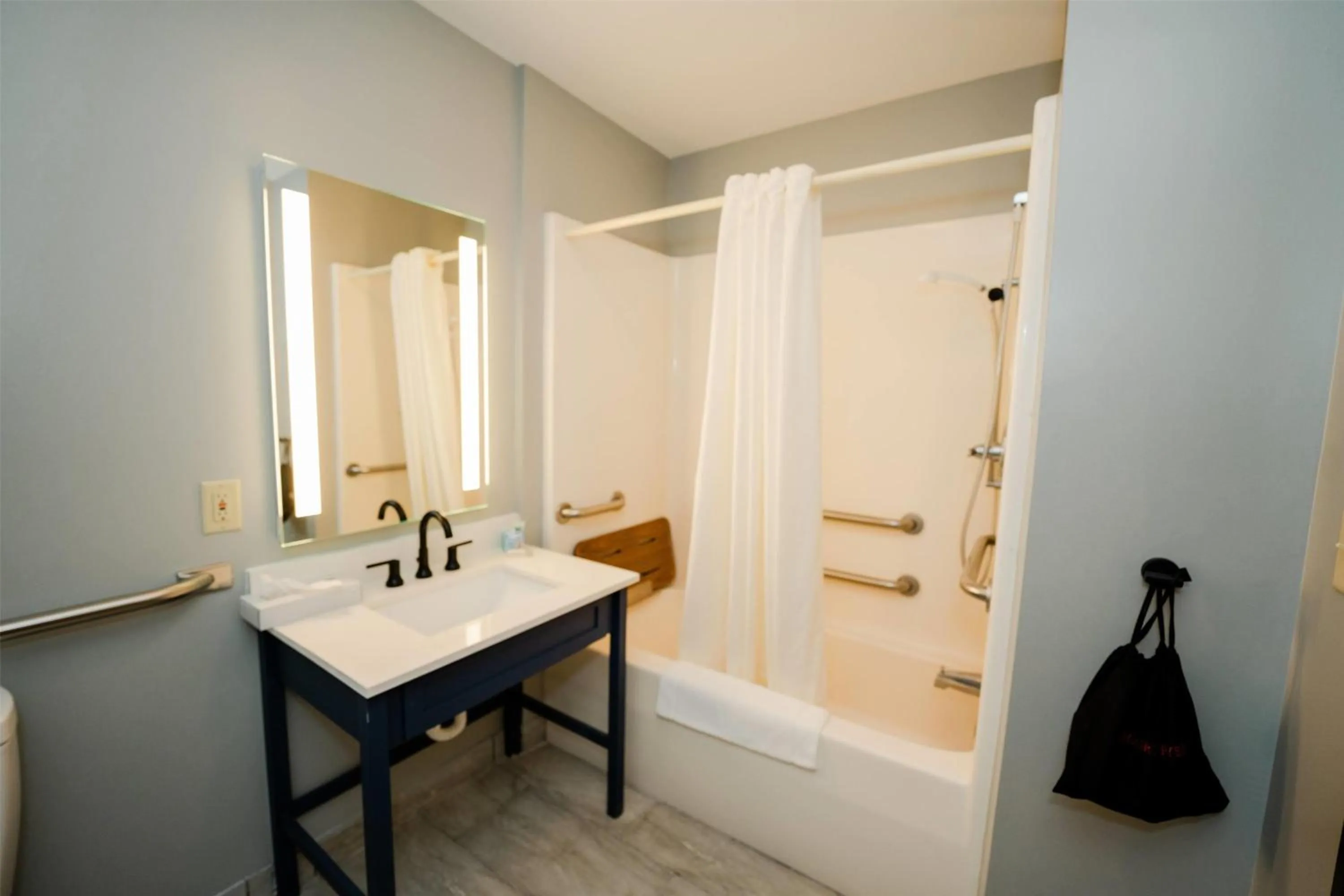 Bathroom in AmericInn by Wyndham Tomahawk