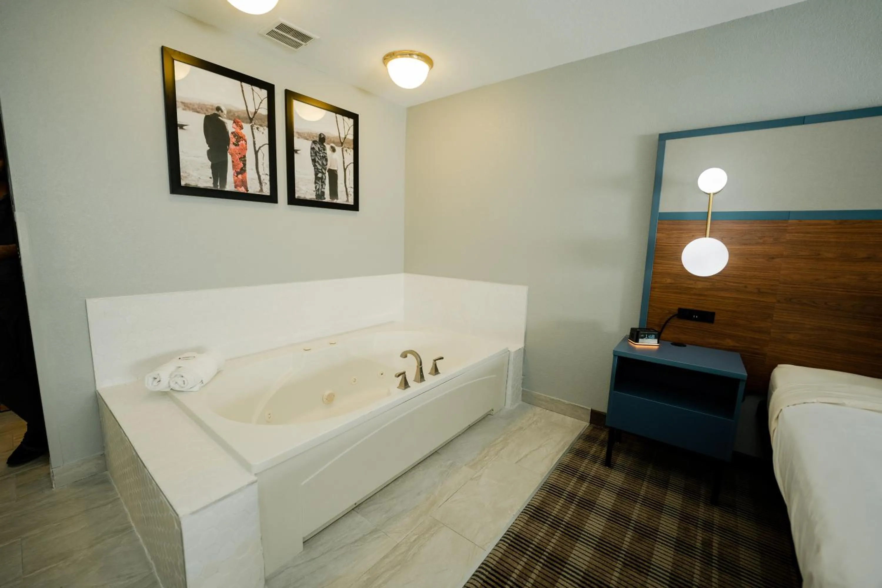 Bed in AmericInn by Wyndham Tomahawk