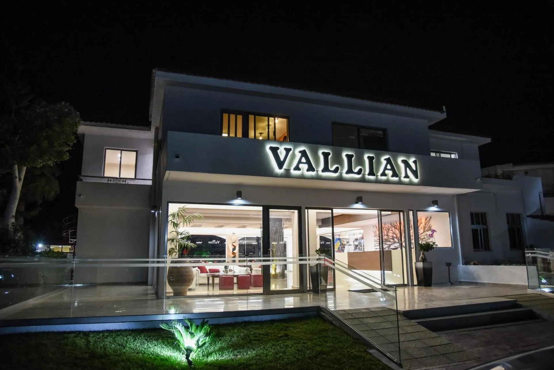 Property logo or sign in Vallian Village Hotel