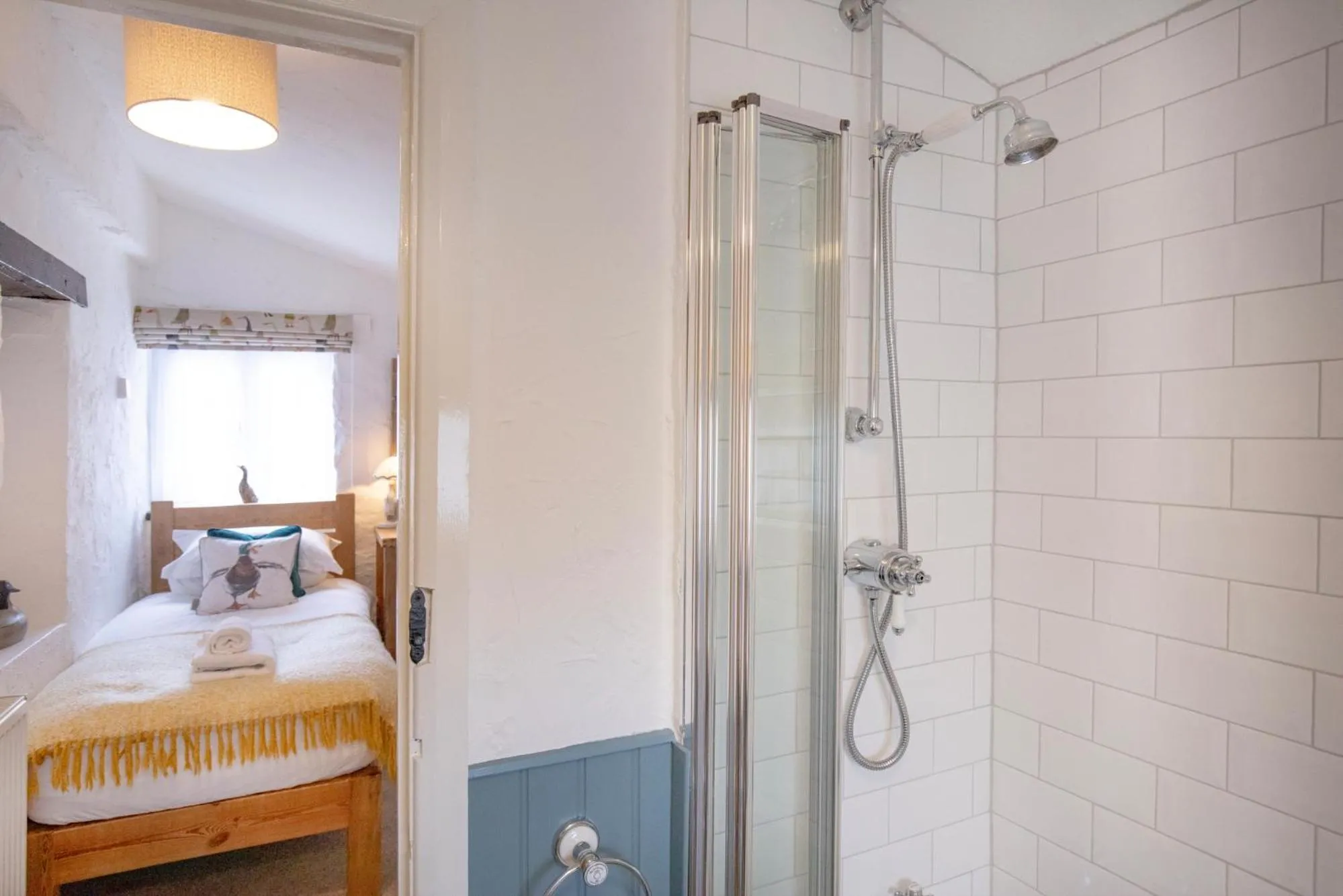 Shower, Bed in Jasmine Cottage