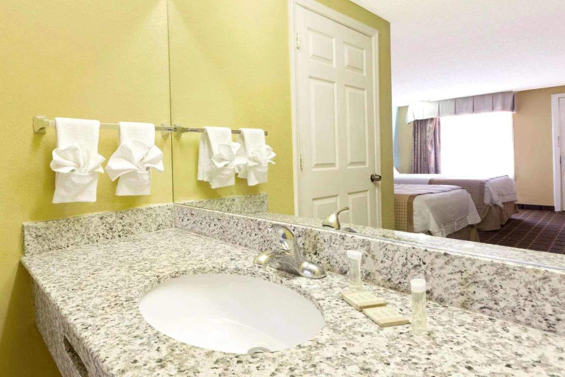 Bathroom, Bed in Rodeway Inn Charlotte Airport Area