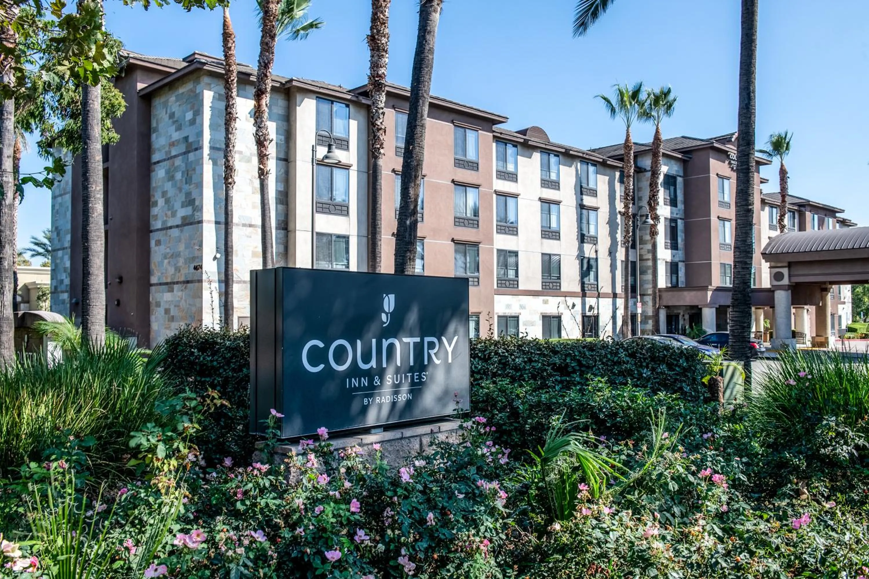Property building in Country Inn & Suites by Radisson, Ontario at Ontario Mills, CA