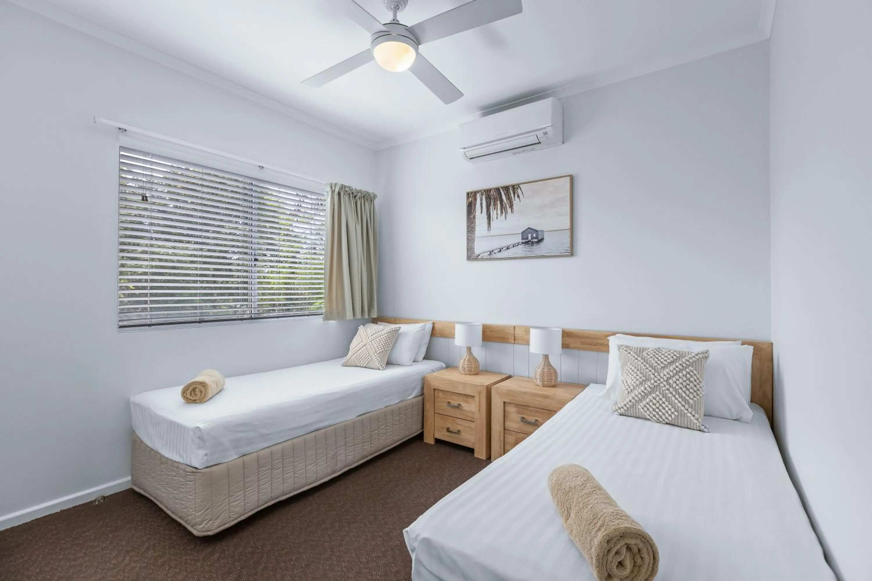 Bed in Cable Beachside Villas