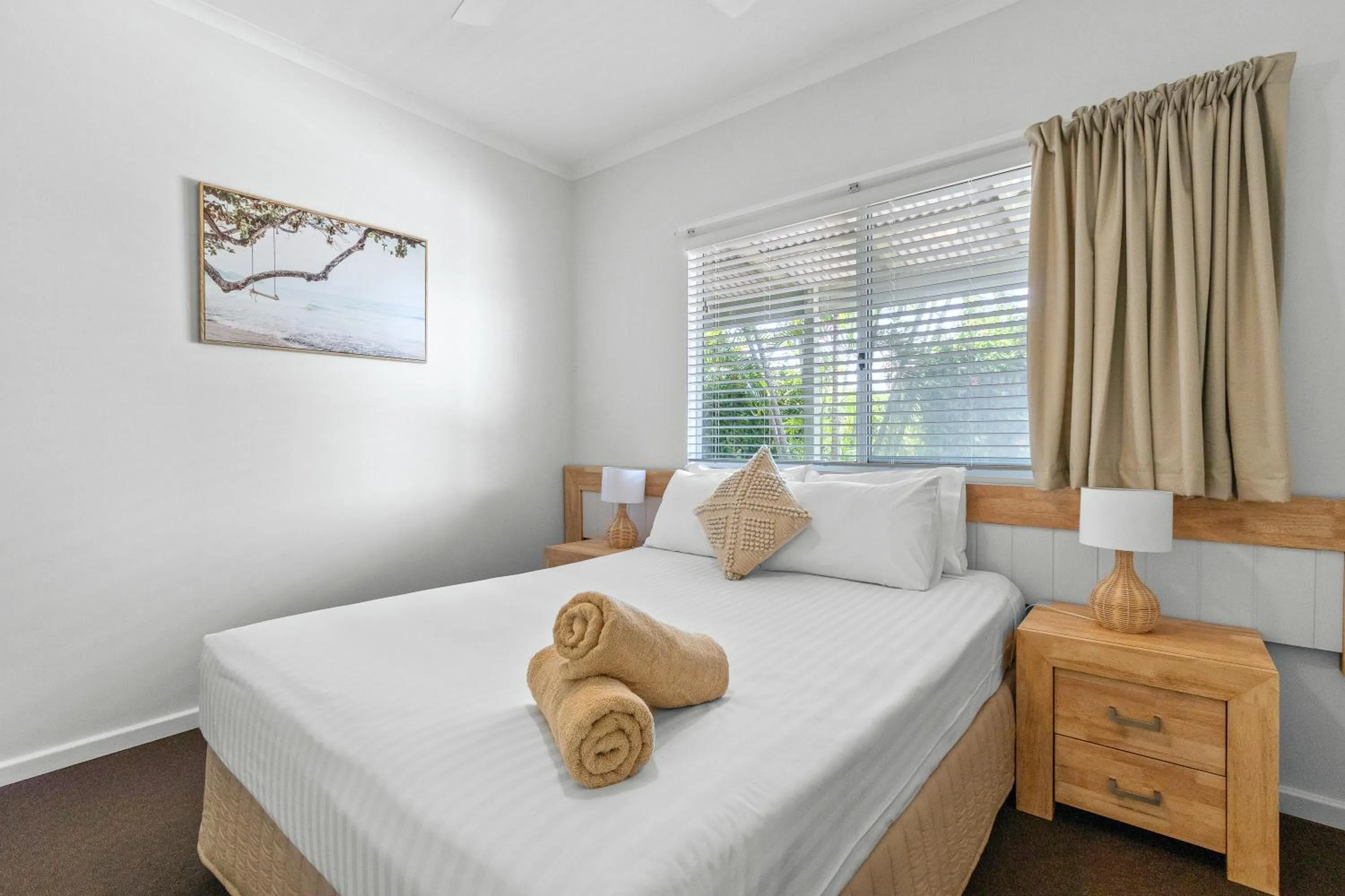 Bed in Cable Beachside Villas