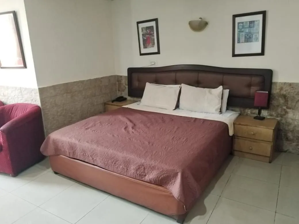 Bed in Amman Palace Hotel