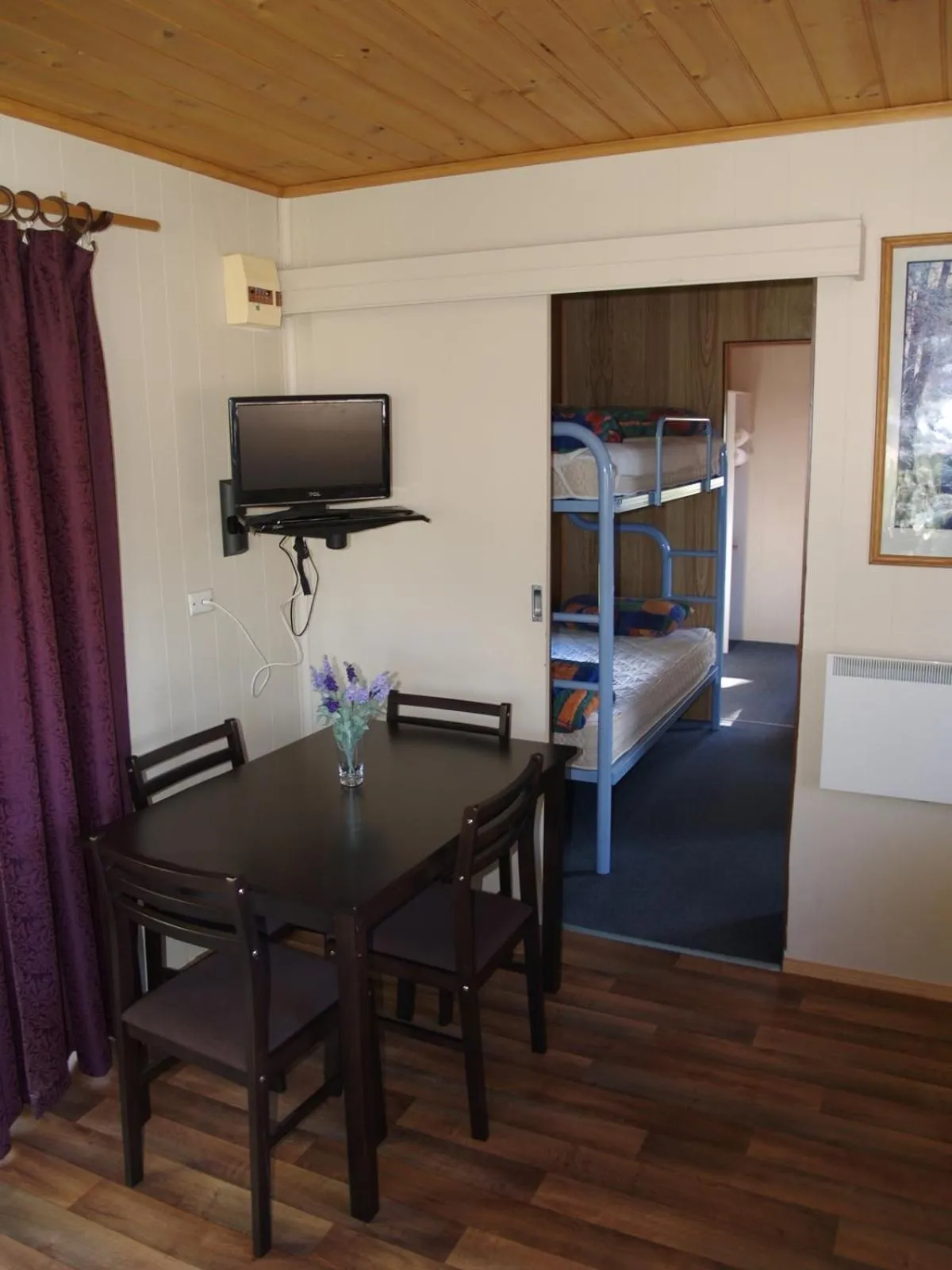 Dining area, Bed in Launceston Holiday Park Legana