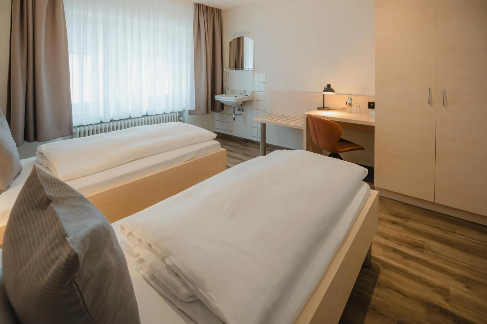 Photo of the whole room, Bed in Hotel Restaurant Tychon AG