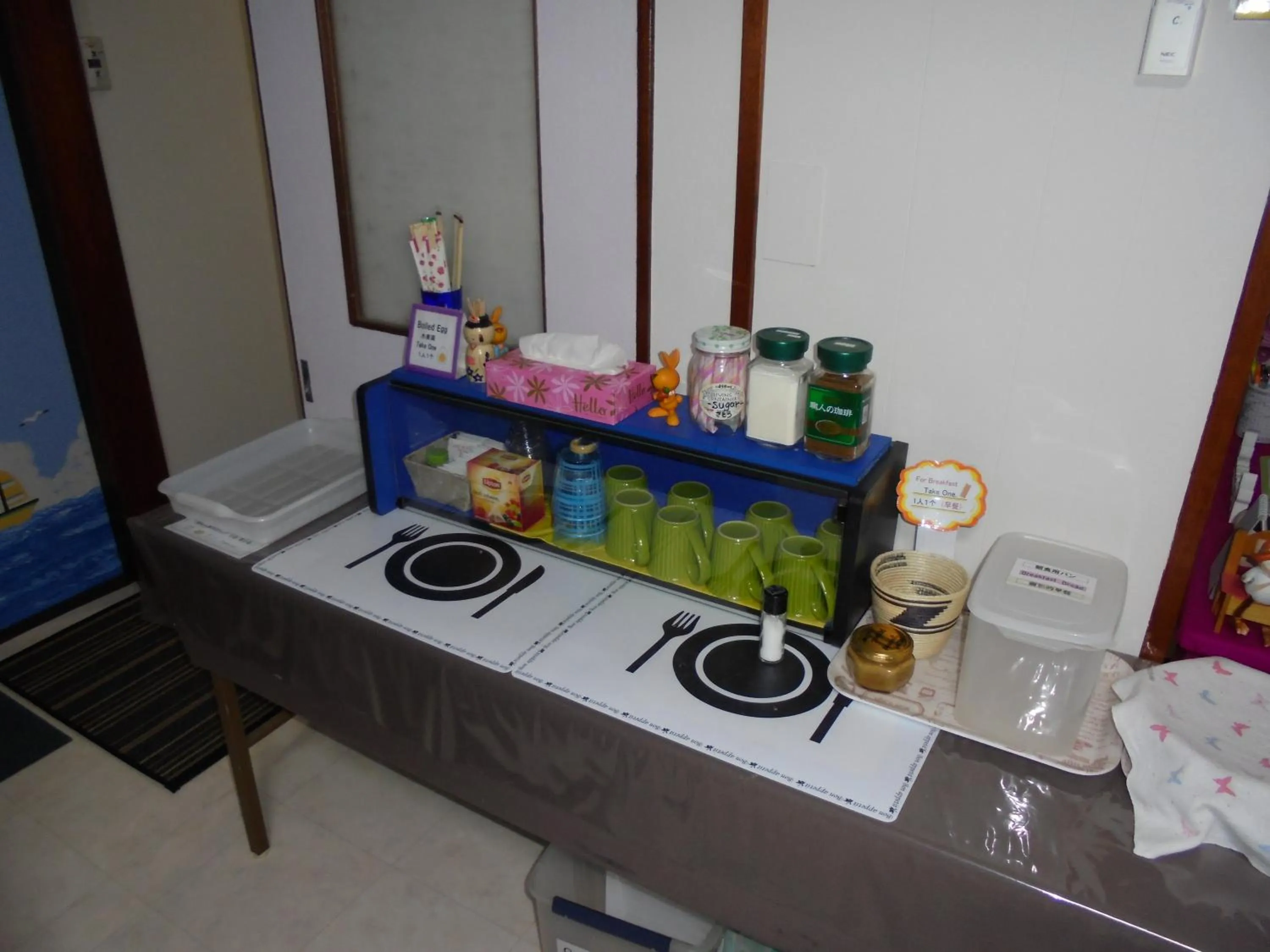 Communal lounge/ TV room in Mike's B&B Tokoname