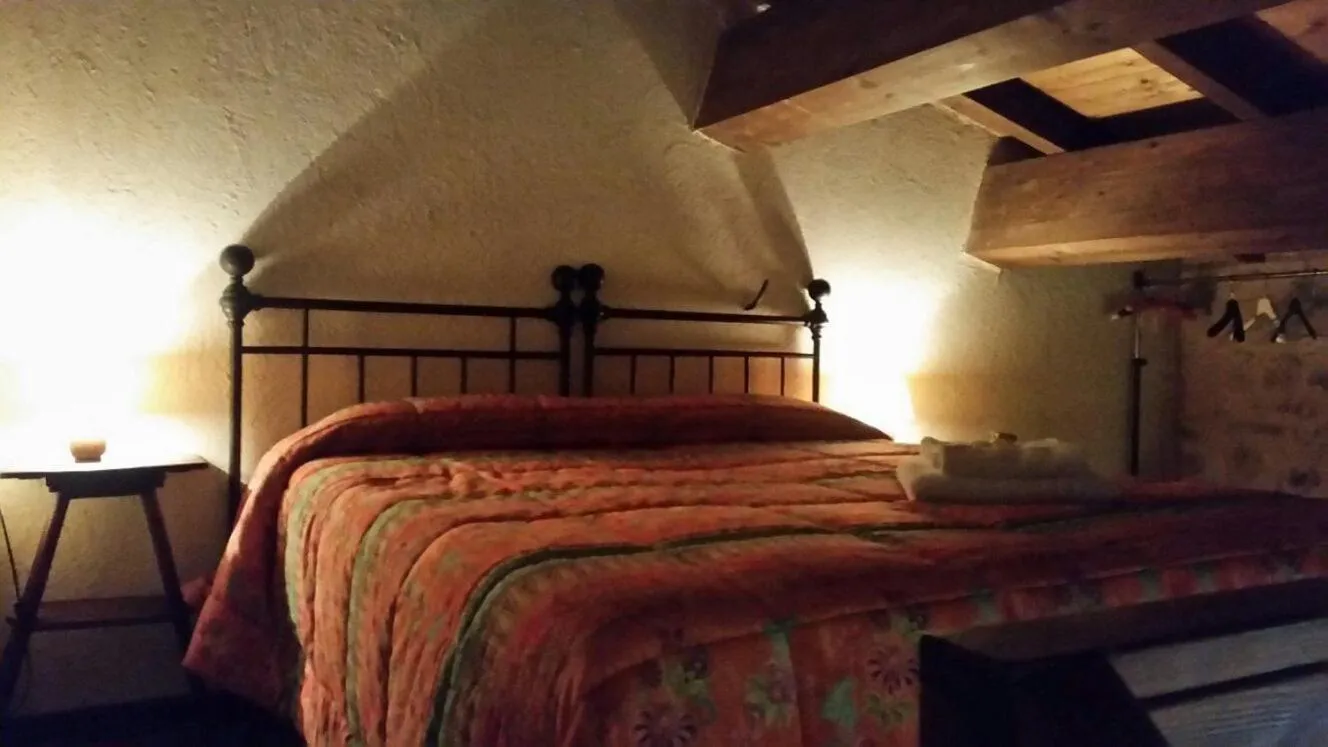 Bed in La Casa Sù Le Dimore Del Borgo
