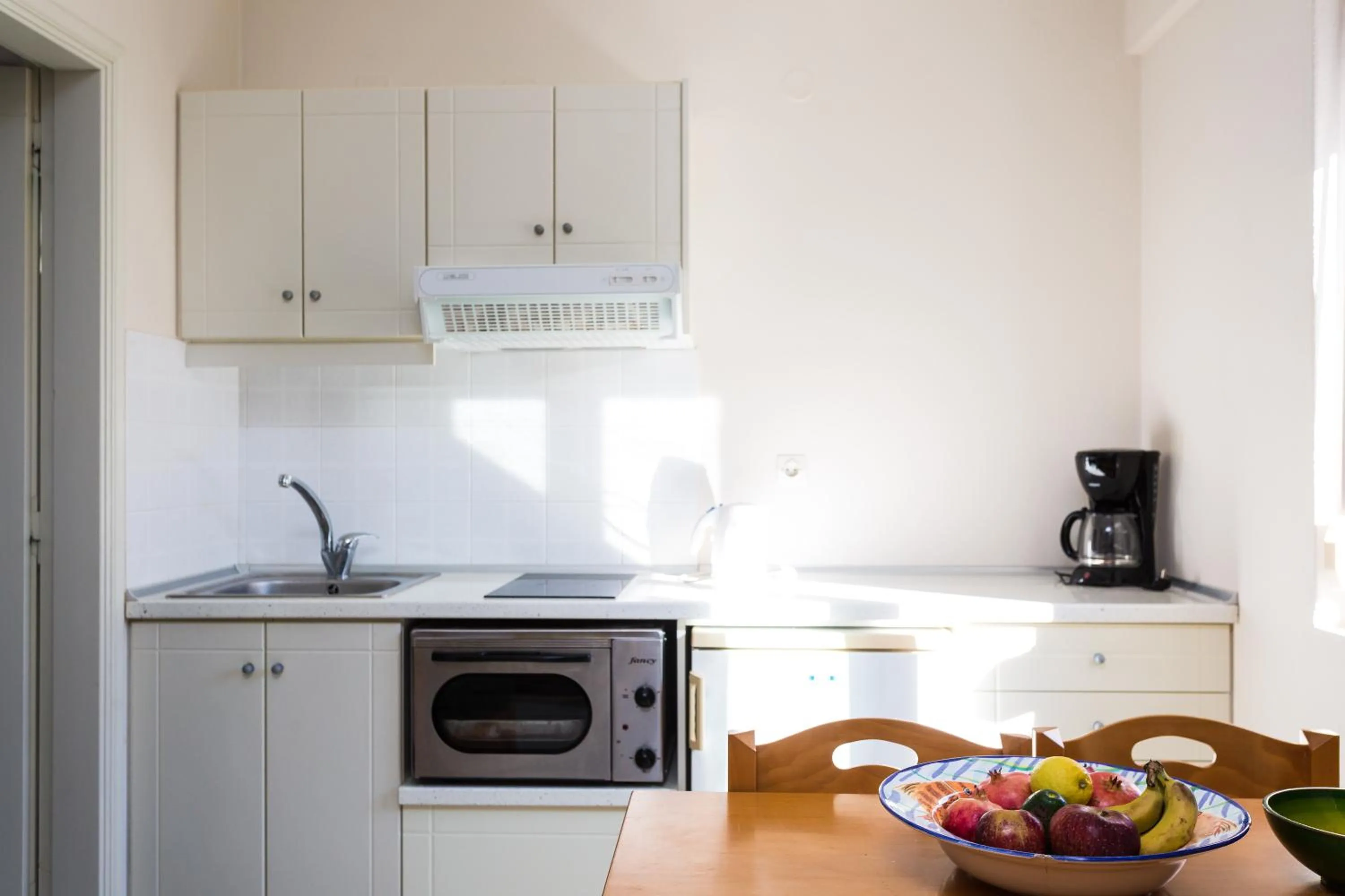 Kitchen or kitchenette in Radamanthy's Hotel Apartments