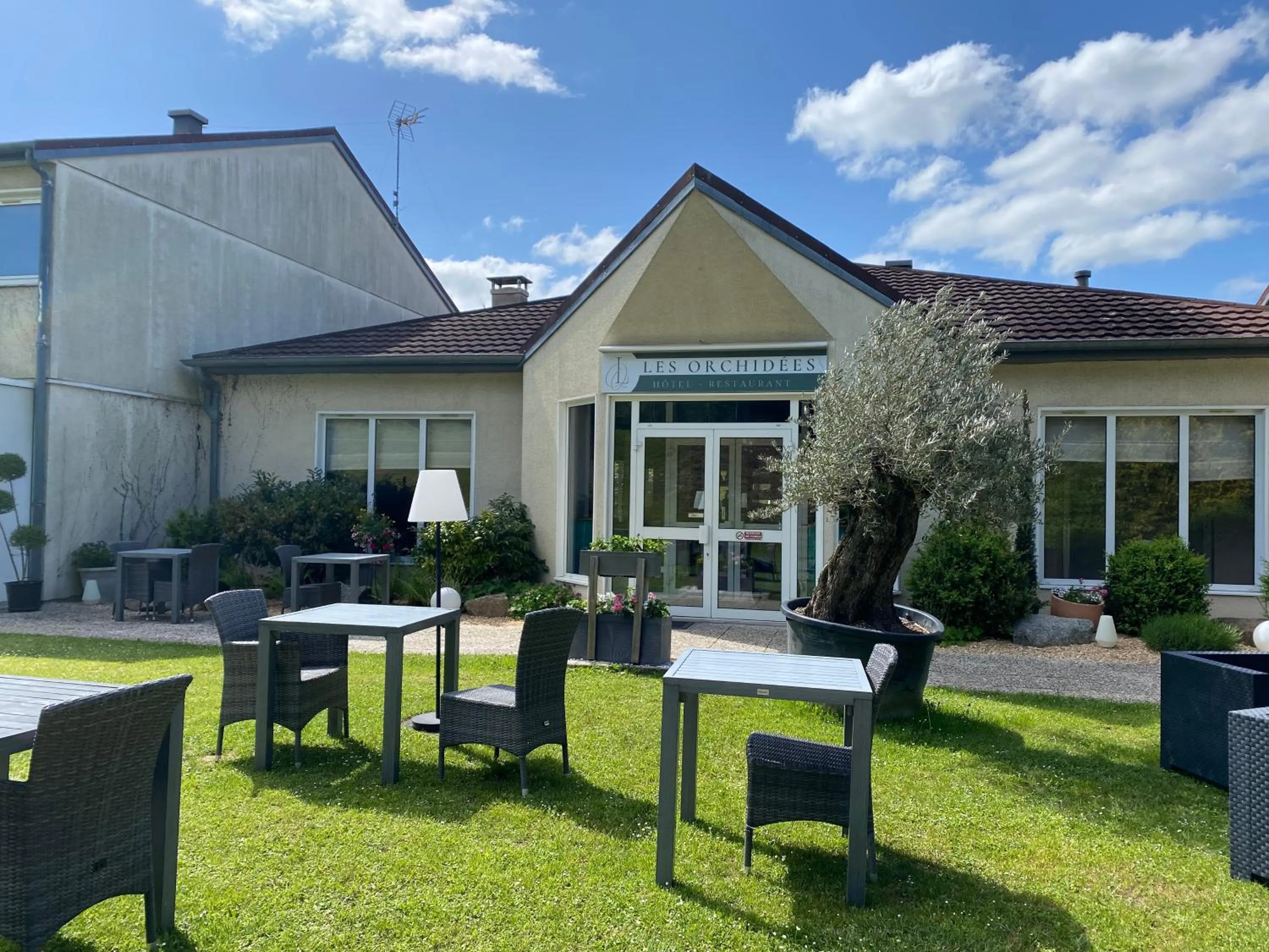 Garden in Les Orchidées , Hôtel & Restaurant