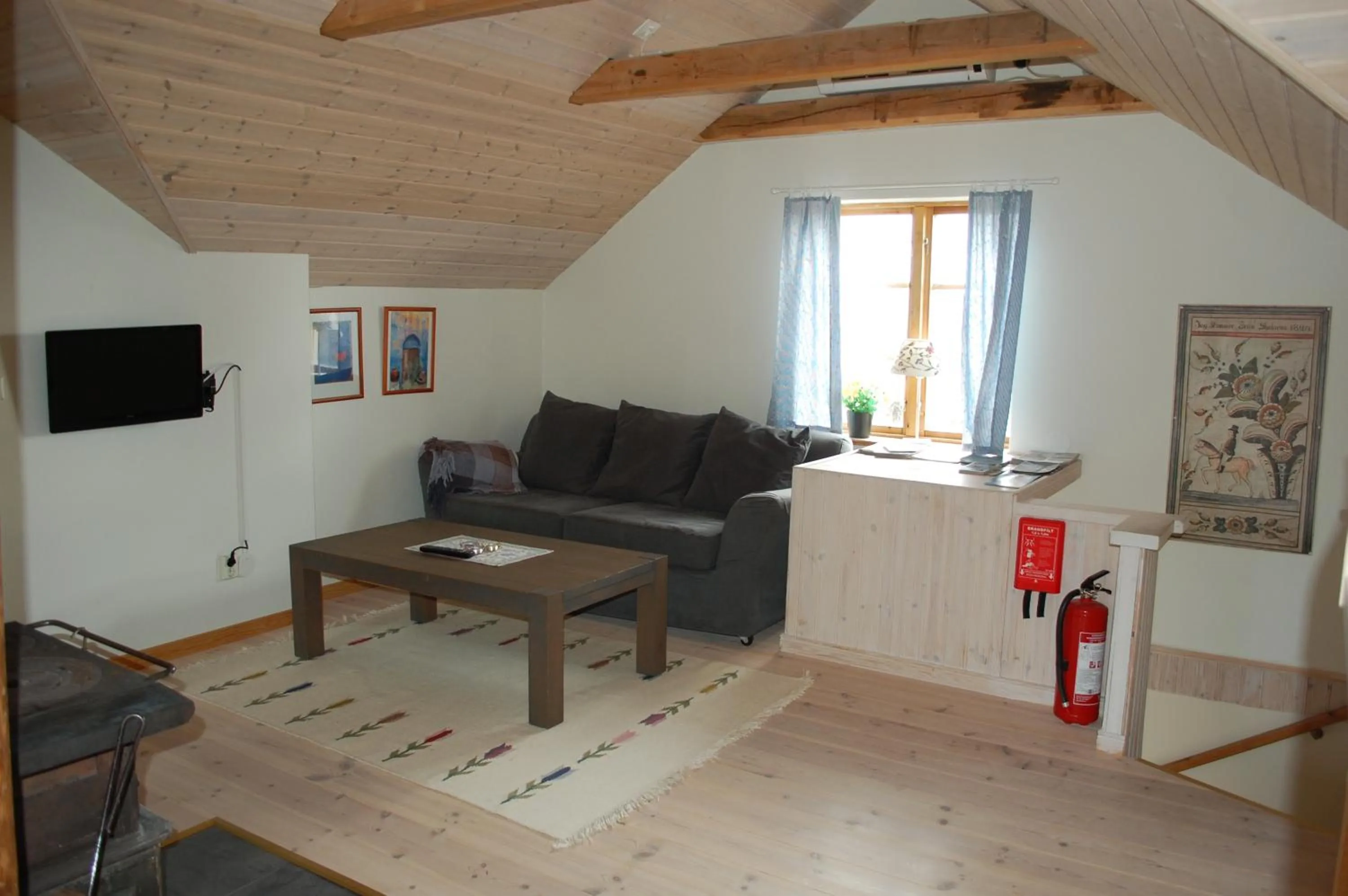 Communal lounge/ TV room in Backlund Boende i Dalarna