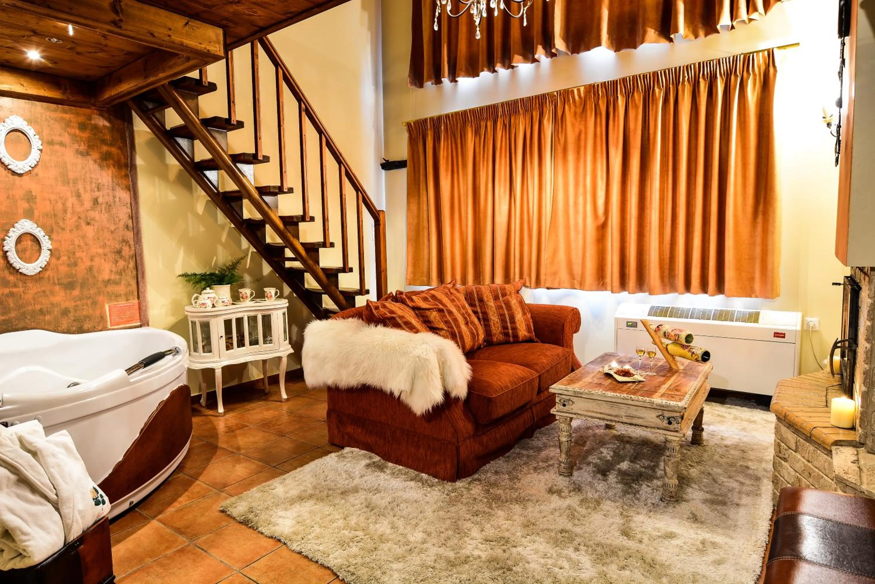Living room, Bed in Camelia Suites