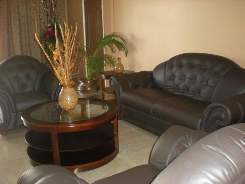 Communal lounge/ TV room in Sheva Hotel