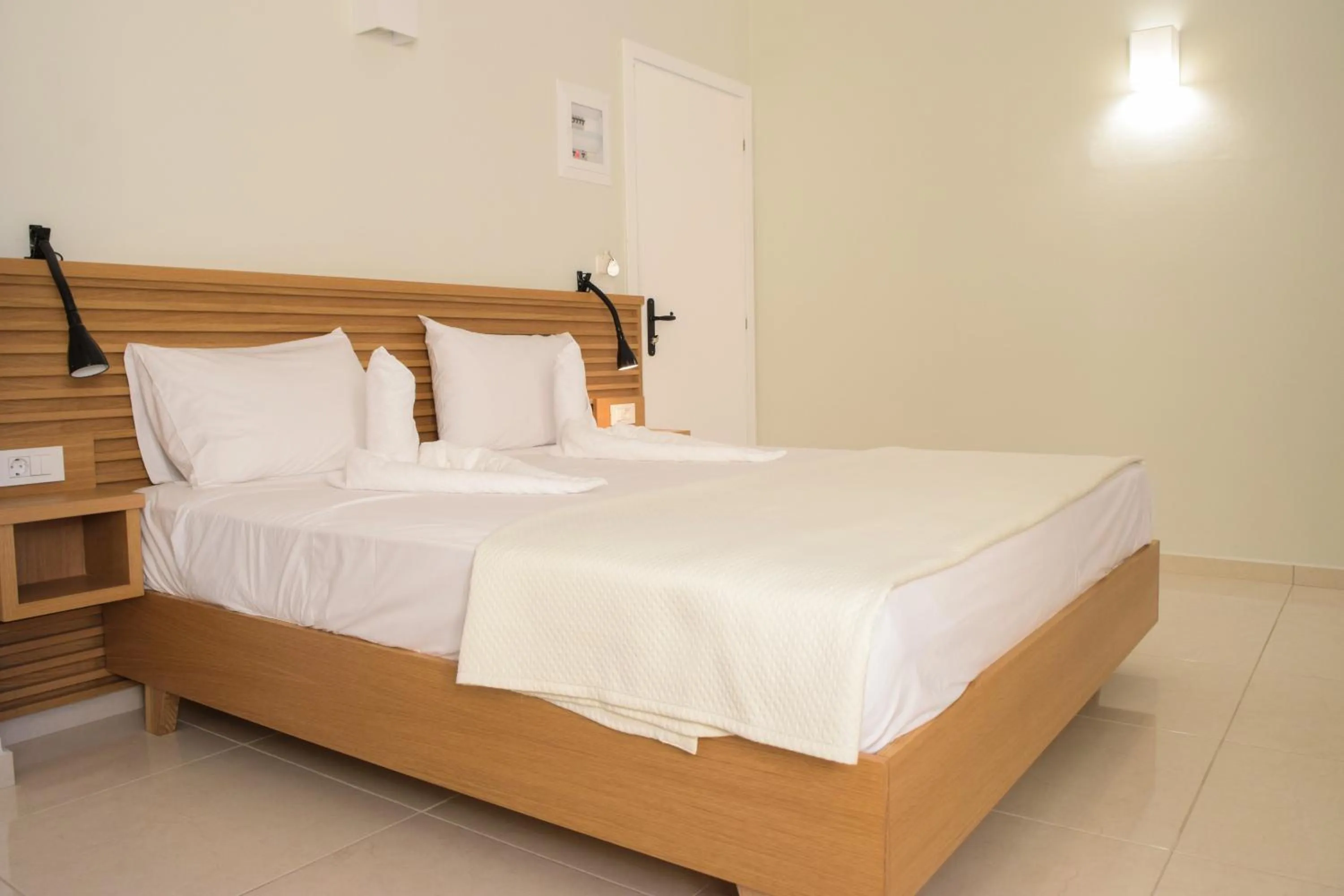 Bed in Mithos Premium Rooms