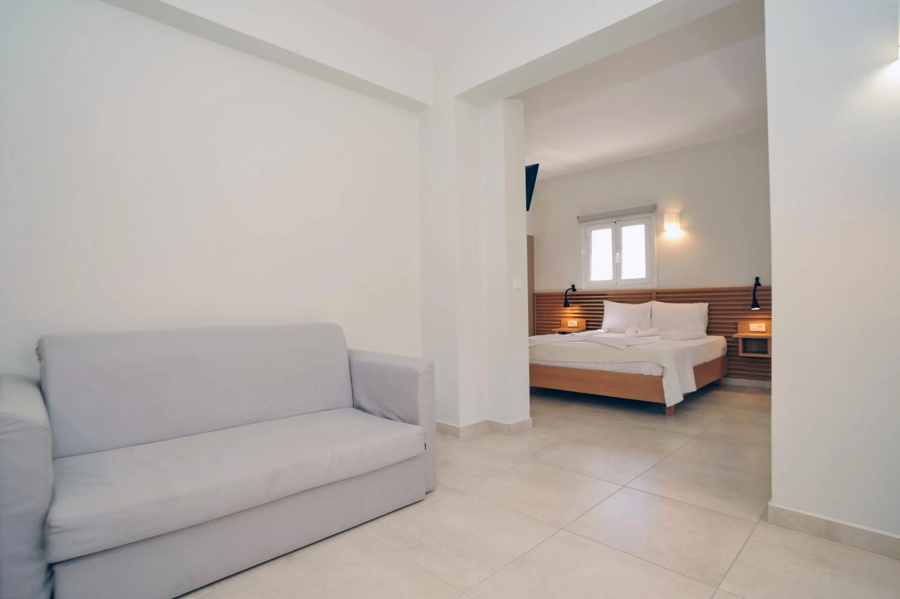 Bed in Mithos Premium Rooms