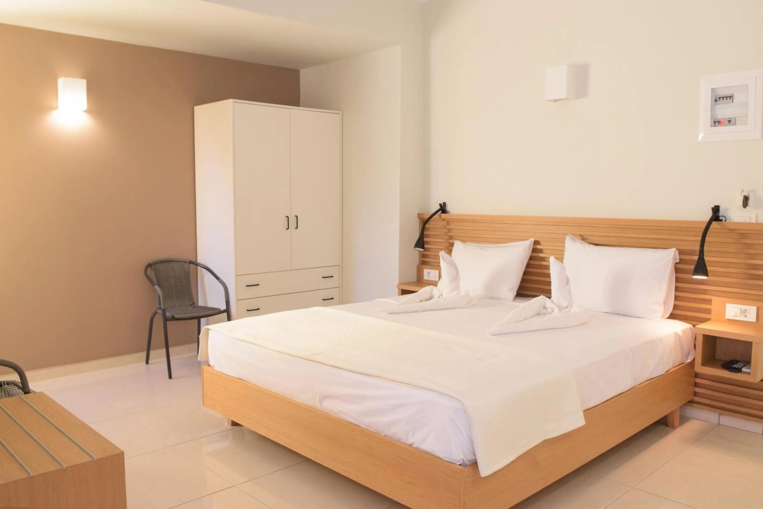 Bed in Mithos Premium Rooms