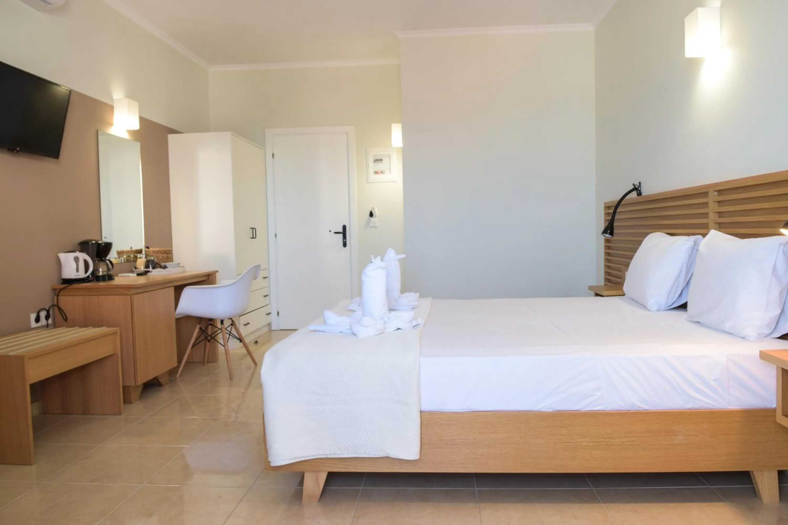 Bed in Mithos Premium Rooms