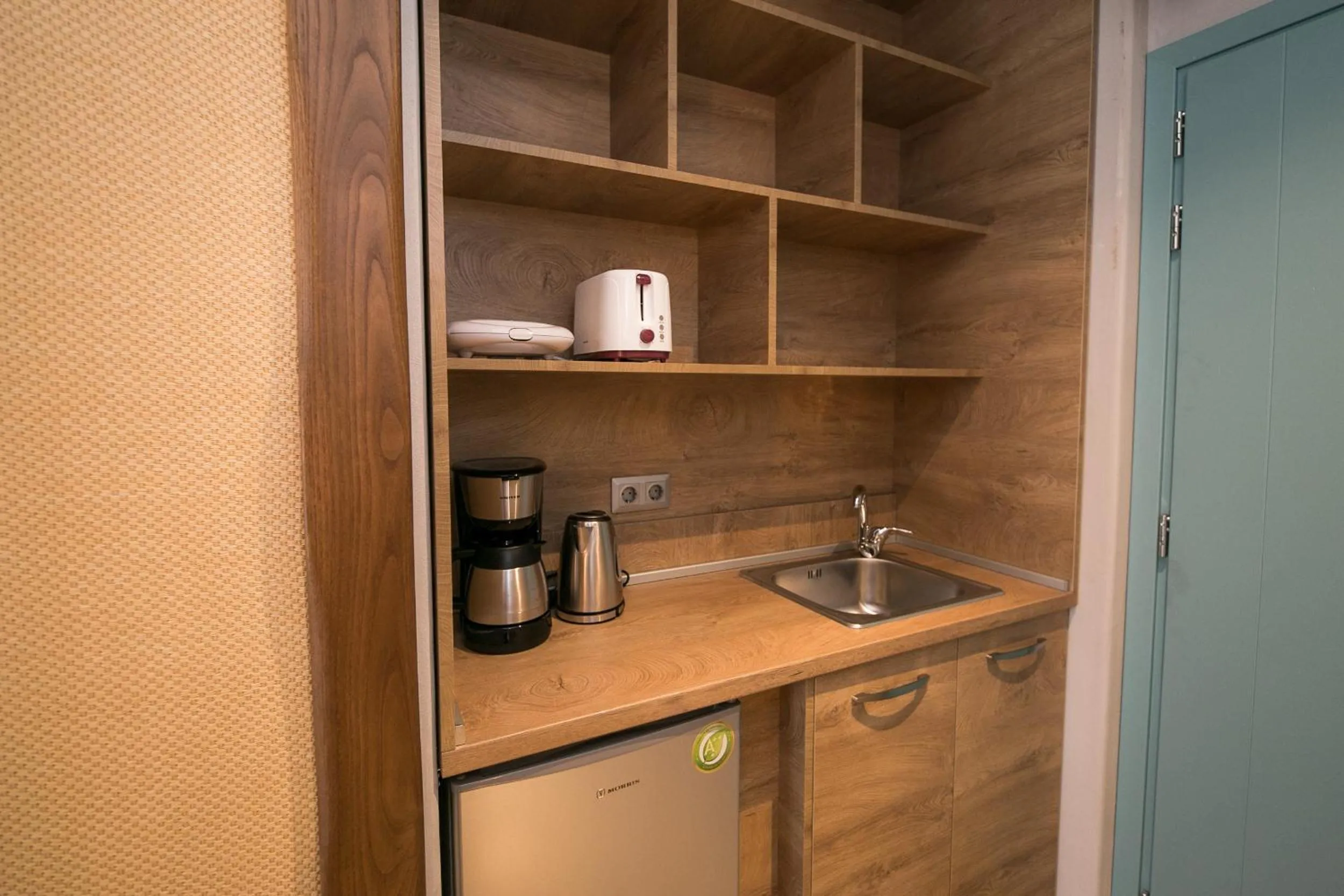 Kitchen or kitchenette in Sunrise Village Hotel Apartments