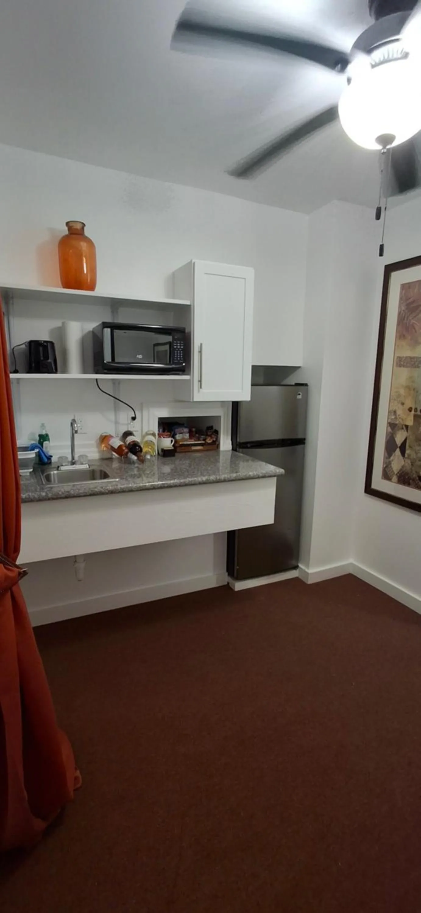 Kitchen or kitchenette in BELL At The Airport Suites Adults Only - Free Airport Transportation