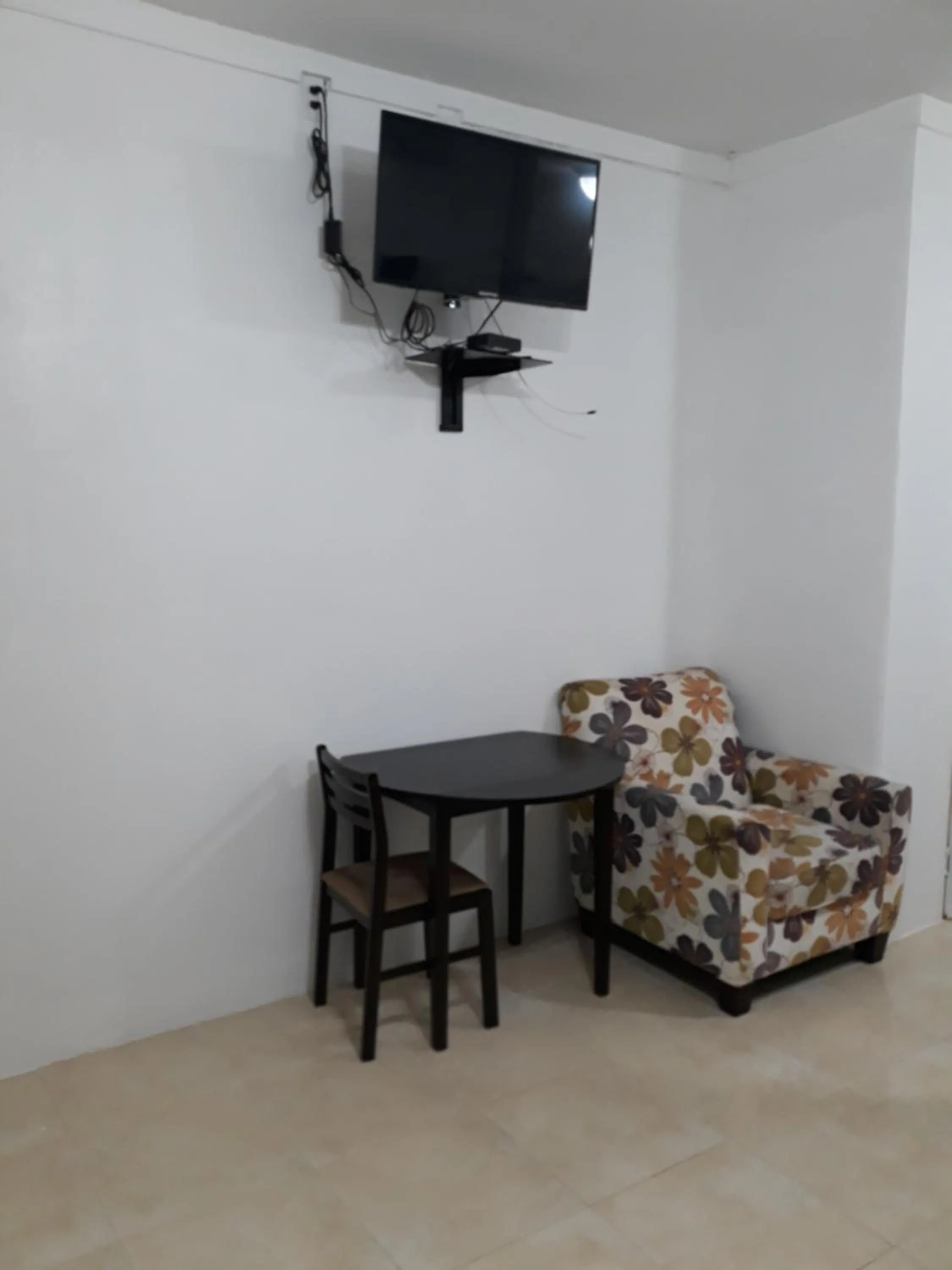TV and multimedia in BELL At The Airport Suites Adults Only - Free Airport Transportation