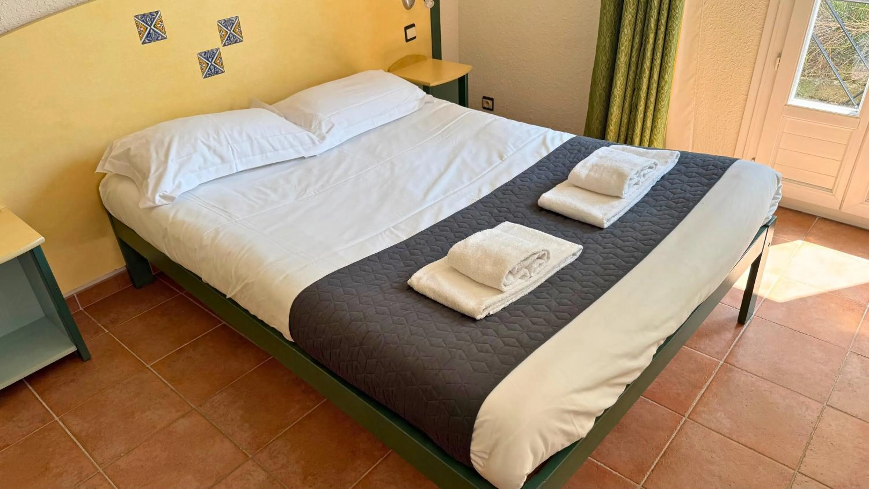 Bed in Village vacances Le Hameau des Oliviers