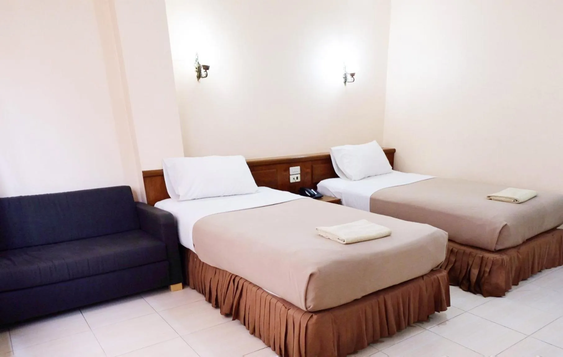 Bed in Top Thai Hotel