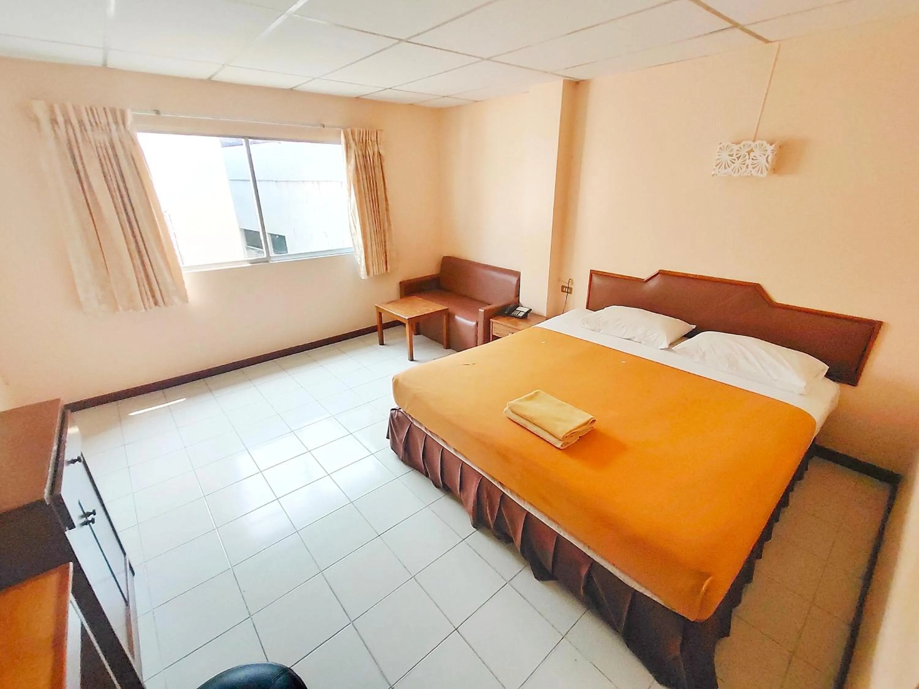 Bed in Top Thai Hotel