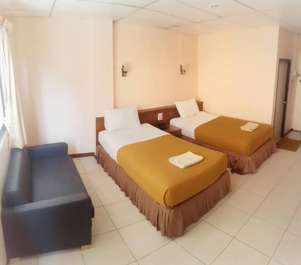 Bed in Top Thai Hotel