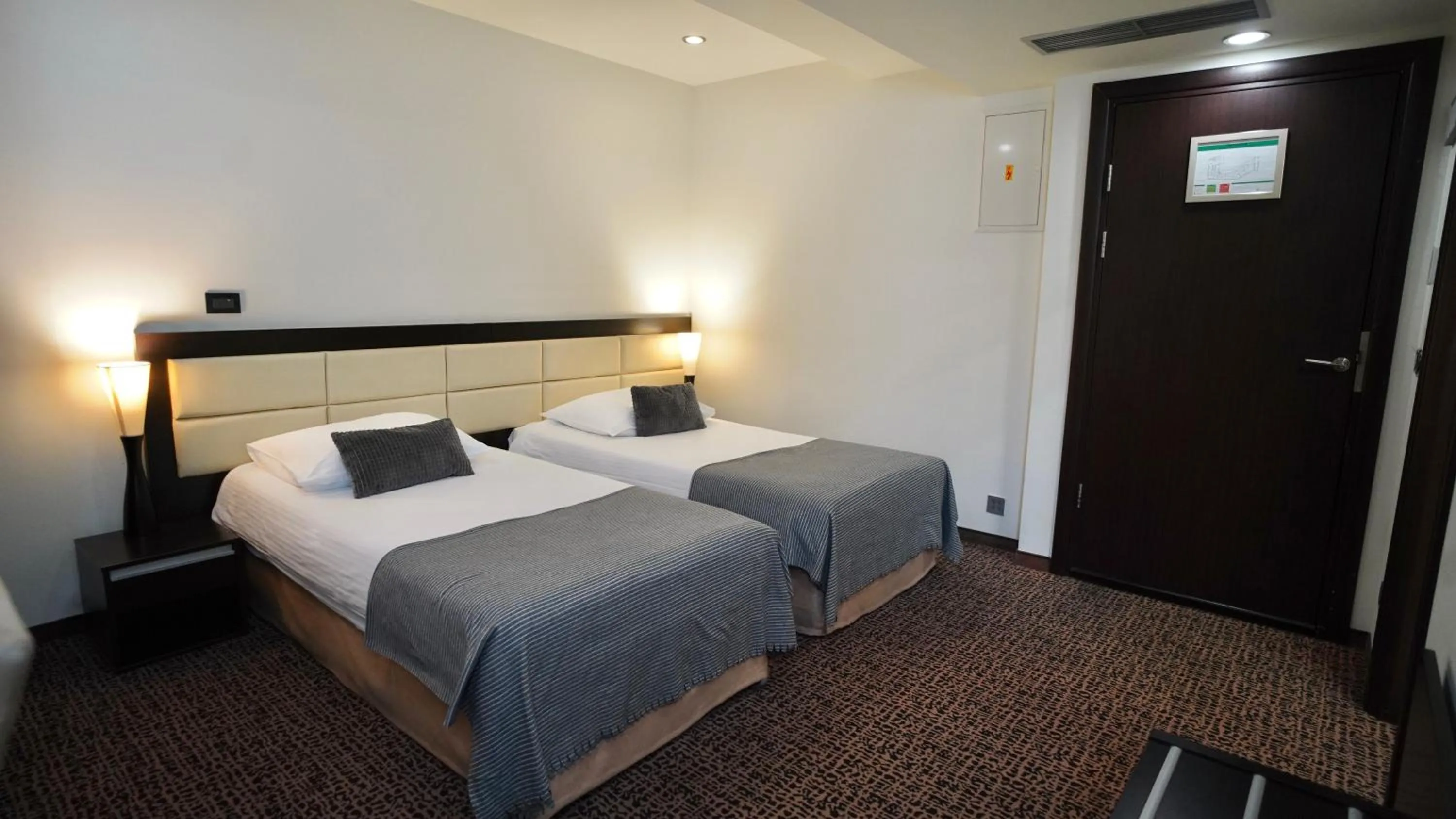 Bed in Hotel Diplomat